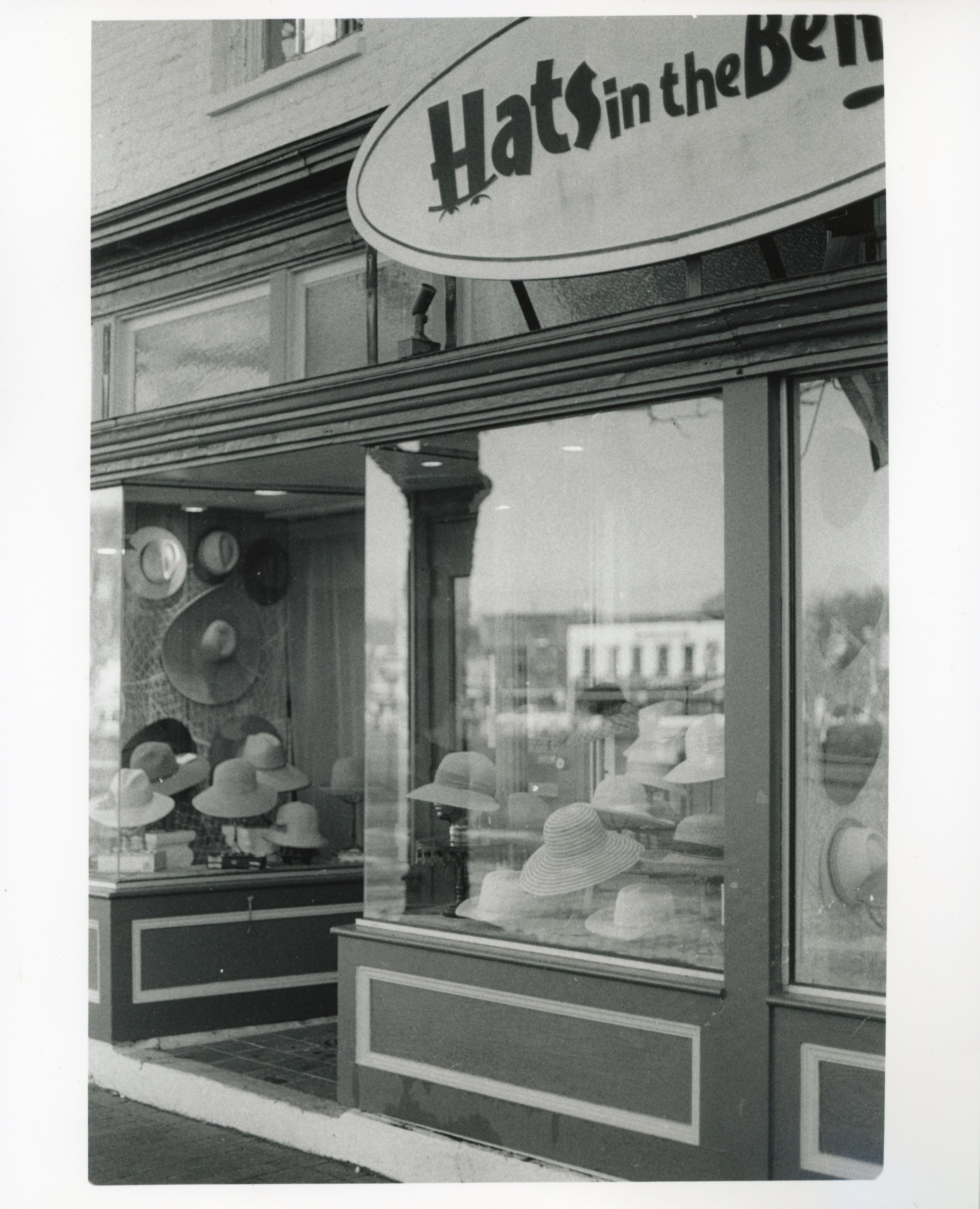 Hat Store Front Window, 2026, Gelatin Silver Print from a B&W 35mm negative, 8” x 10”