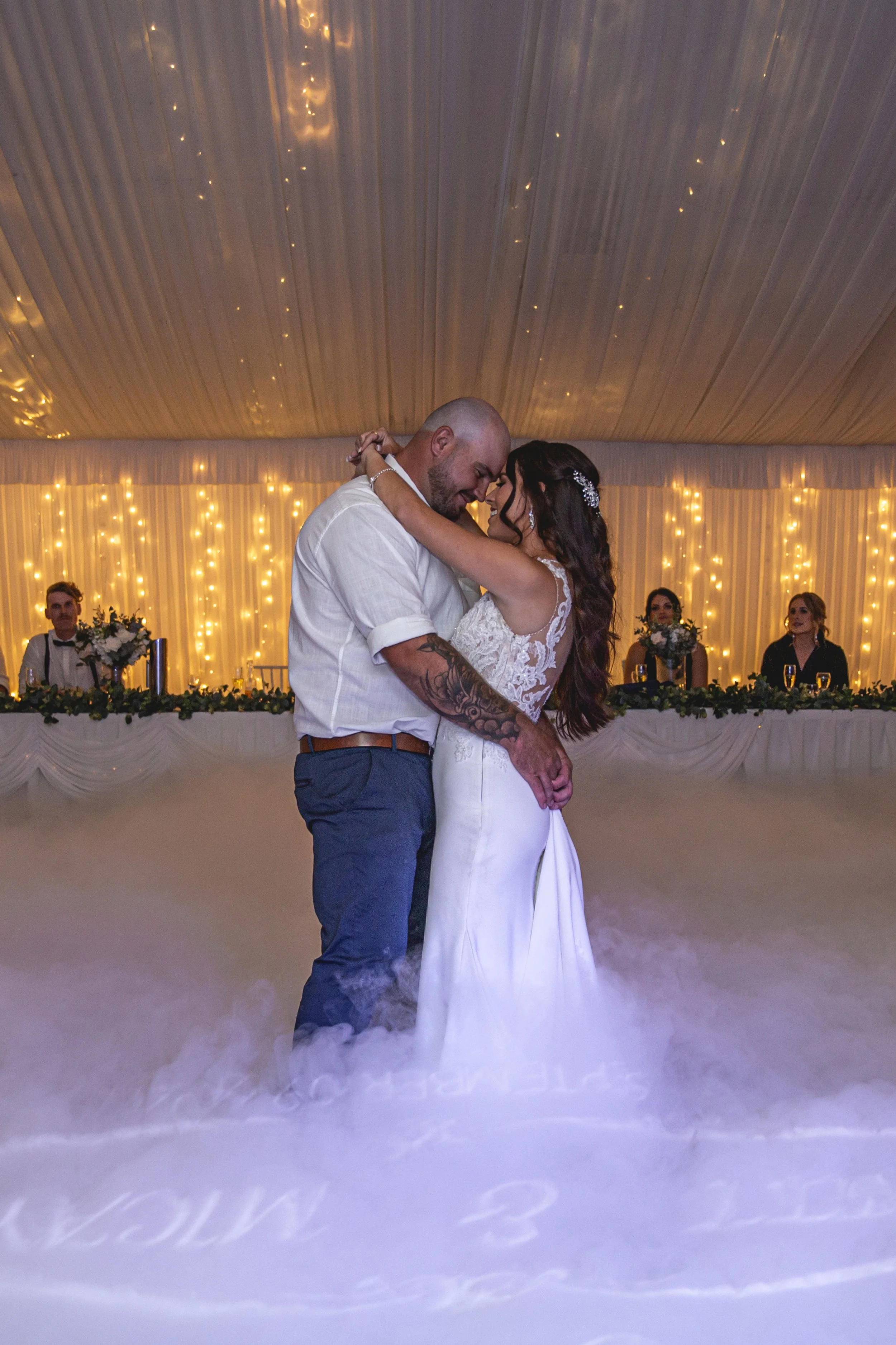 Couple share first dance with fog on the ground at Coolabah Downs Private Estate.