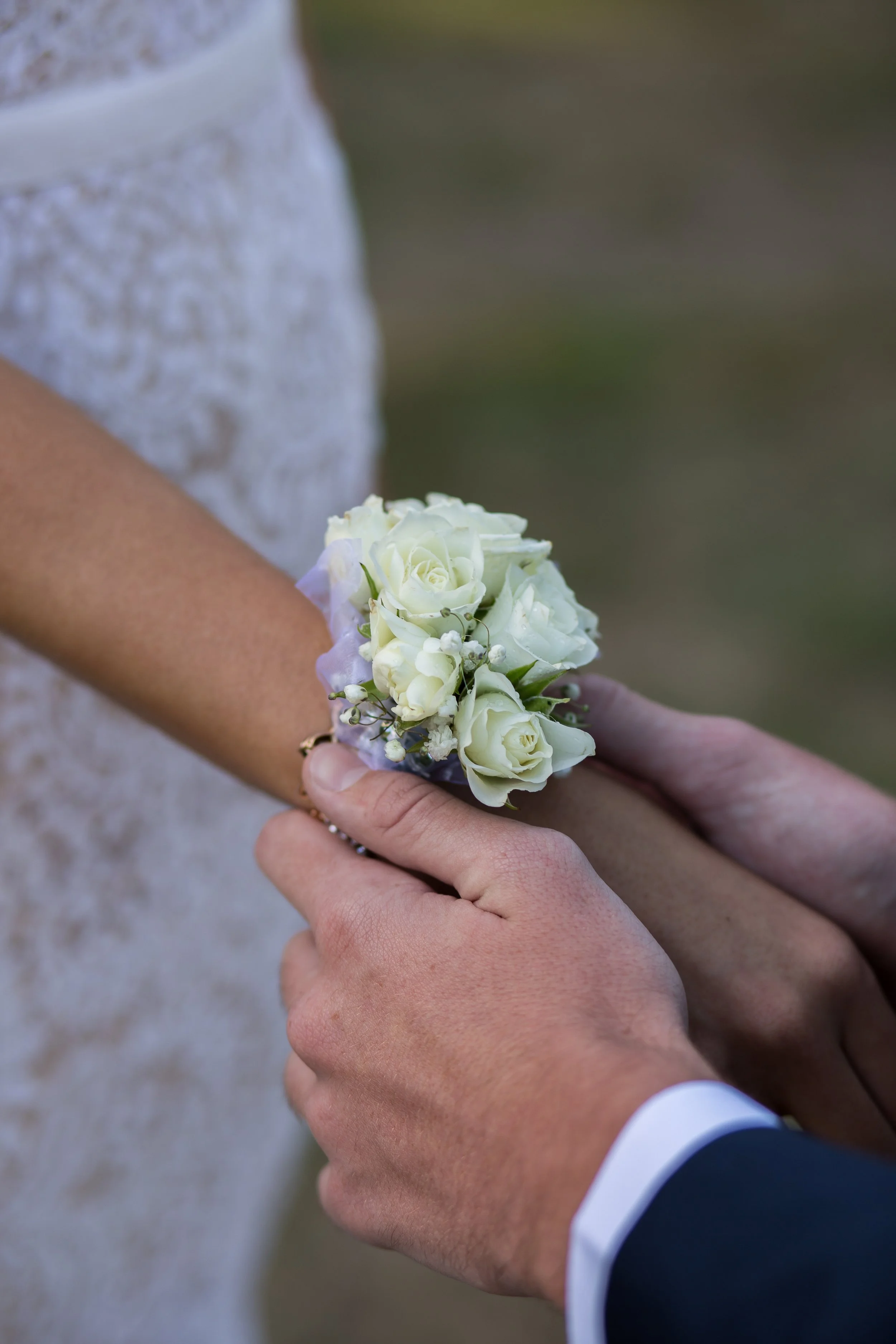 Formal students exchange floral corsage.