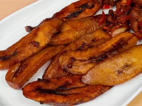 Fried plantains on a white plate.