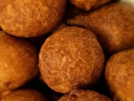 Close-up of round fried food balls, likely meat or potato croquettes.