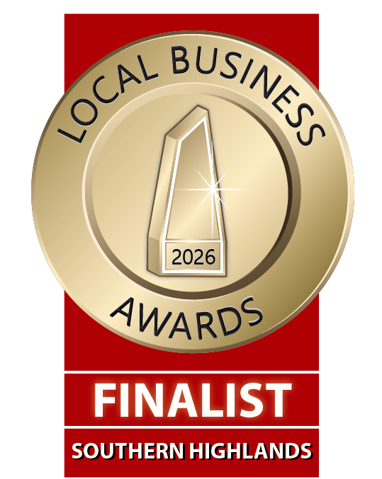 Gold circular award badge for the 2026 Local Business Awards with a silhouette of a mountain and the number 2026, labeled as a finalist from the Southern Highlands.
