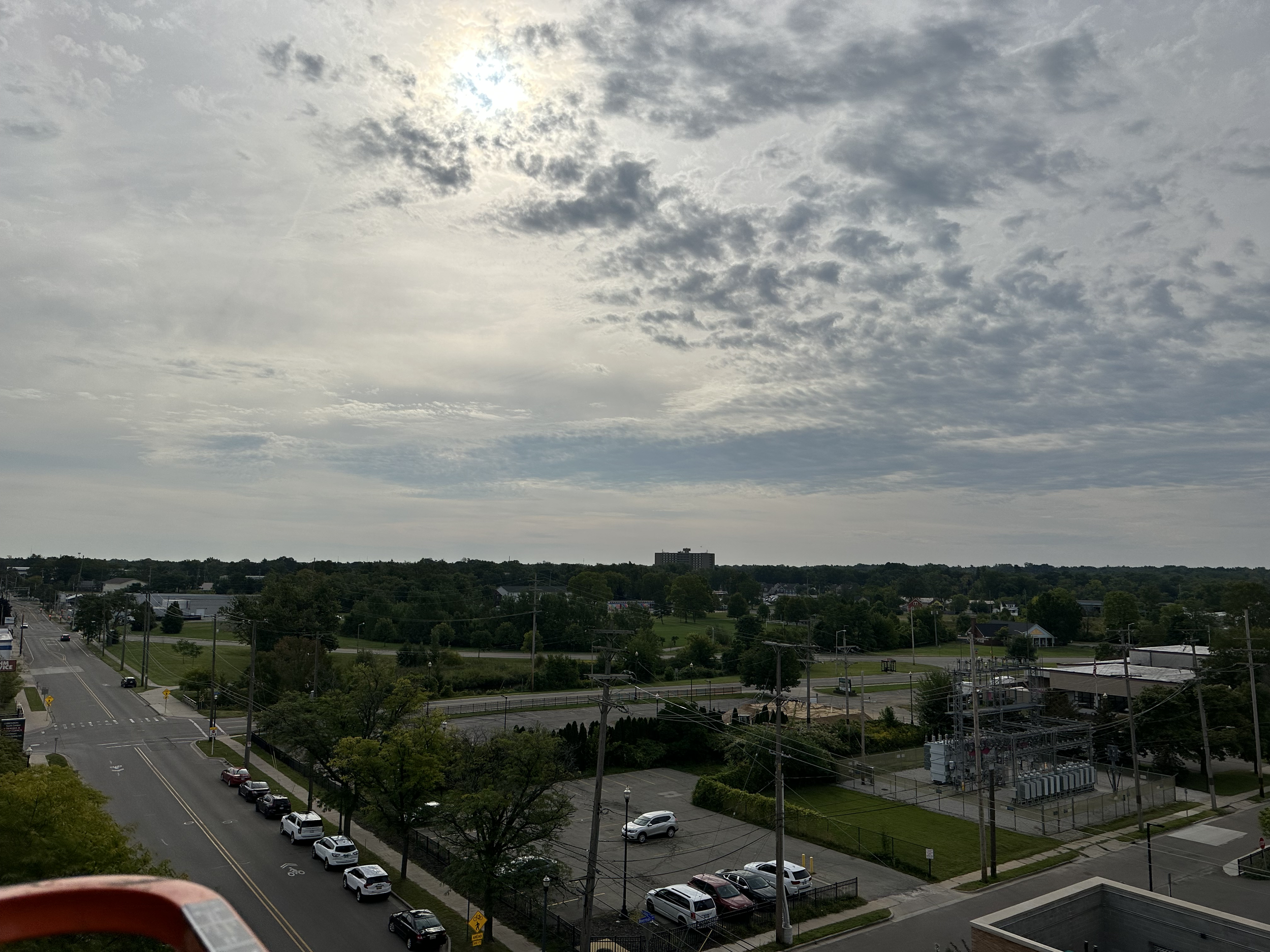 Professional window cleaner takes a picture of the horizon from the top of a boom lift at Bronson Hospital in Kalamazoo Michigan.