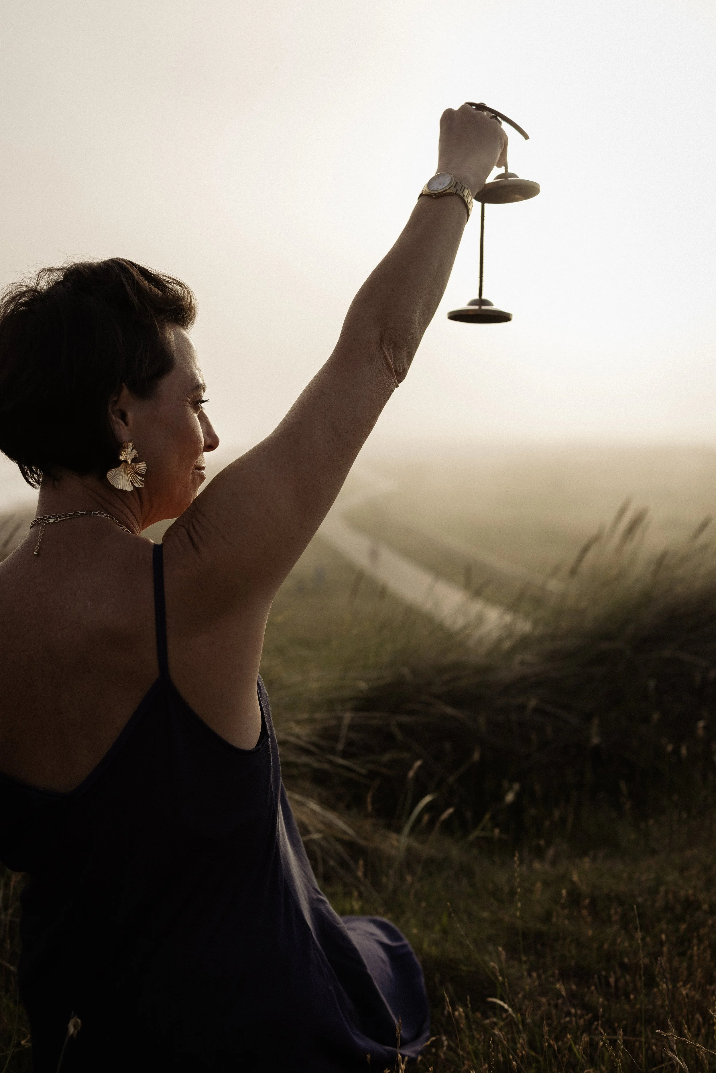 Lou Buck using sound healing instruments for a relaxation session
