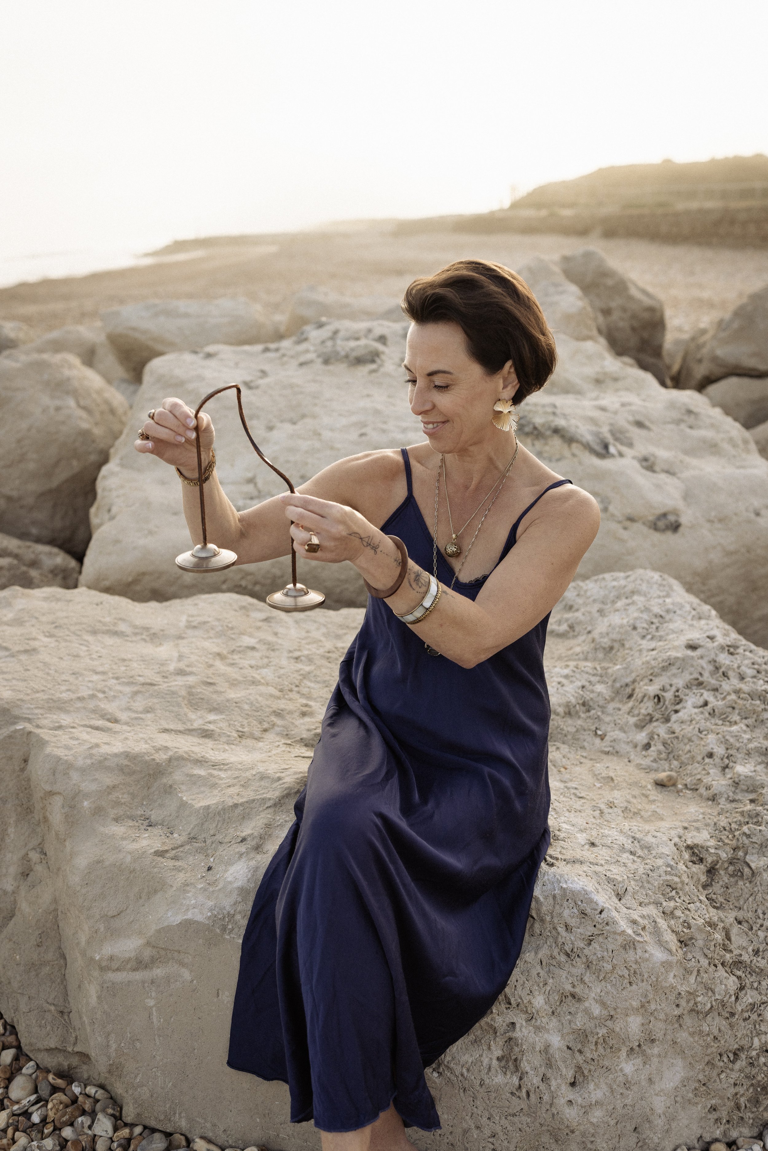 Lou Buck holding healing instrument