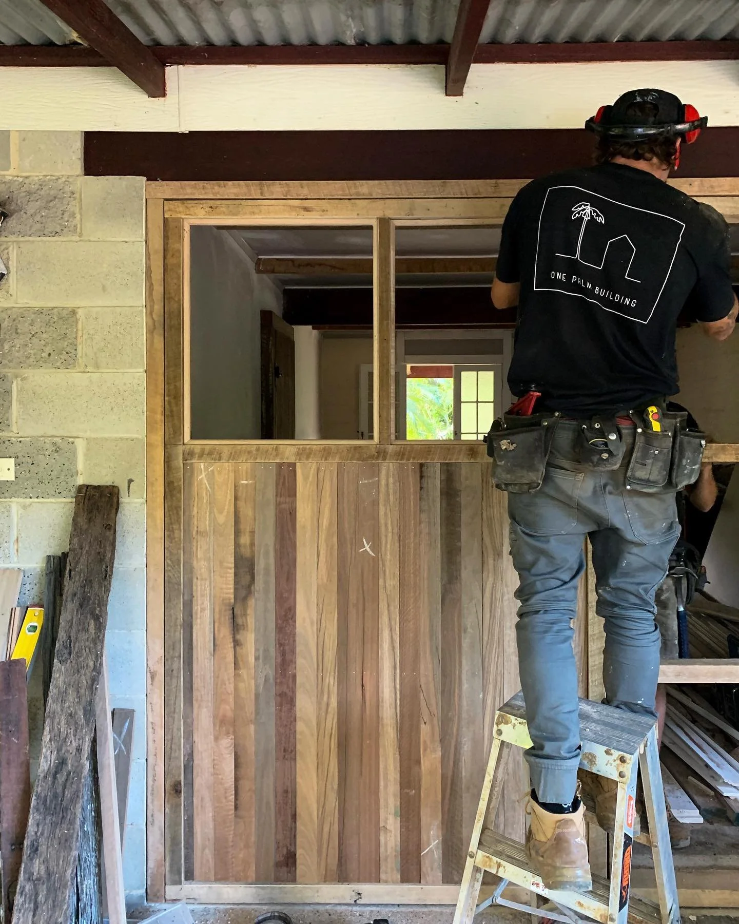 One Palm Building's small building team creating a custom barn door for our Middle Pocket project