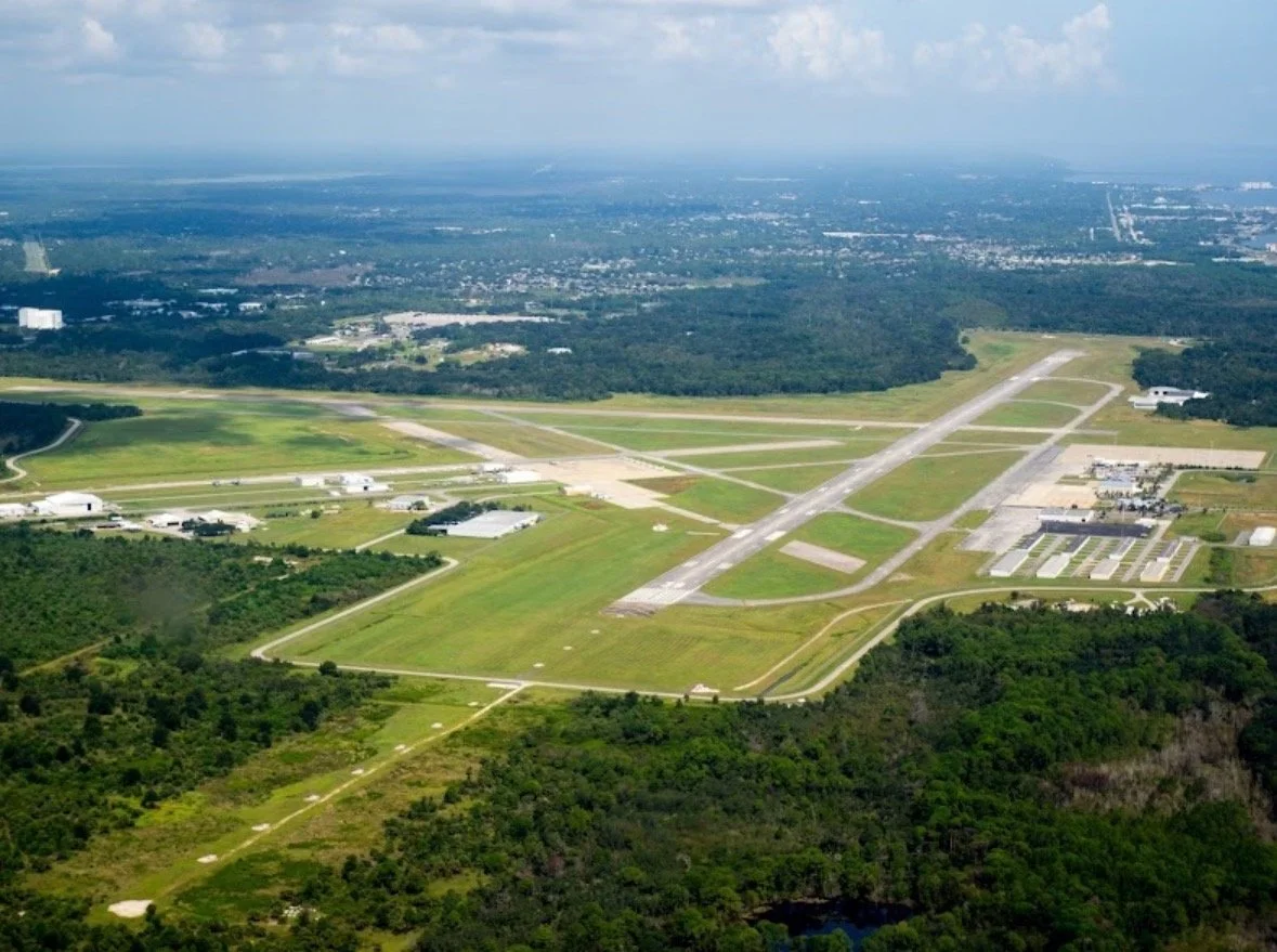 ⁠Aerial view of Space Coast Regional Airport (TIX) in Titusville, offering on-site mobile aircraft detailing and hangar services.⁠