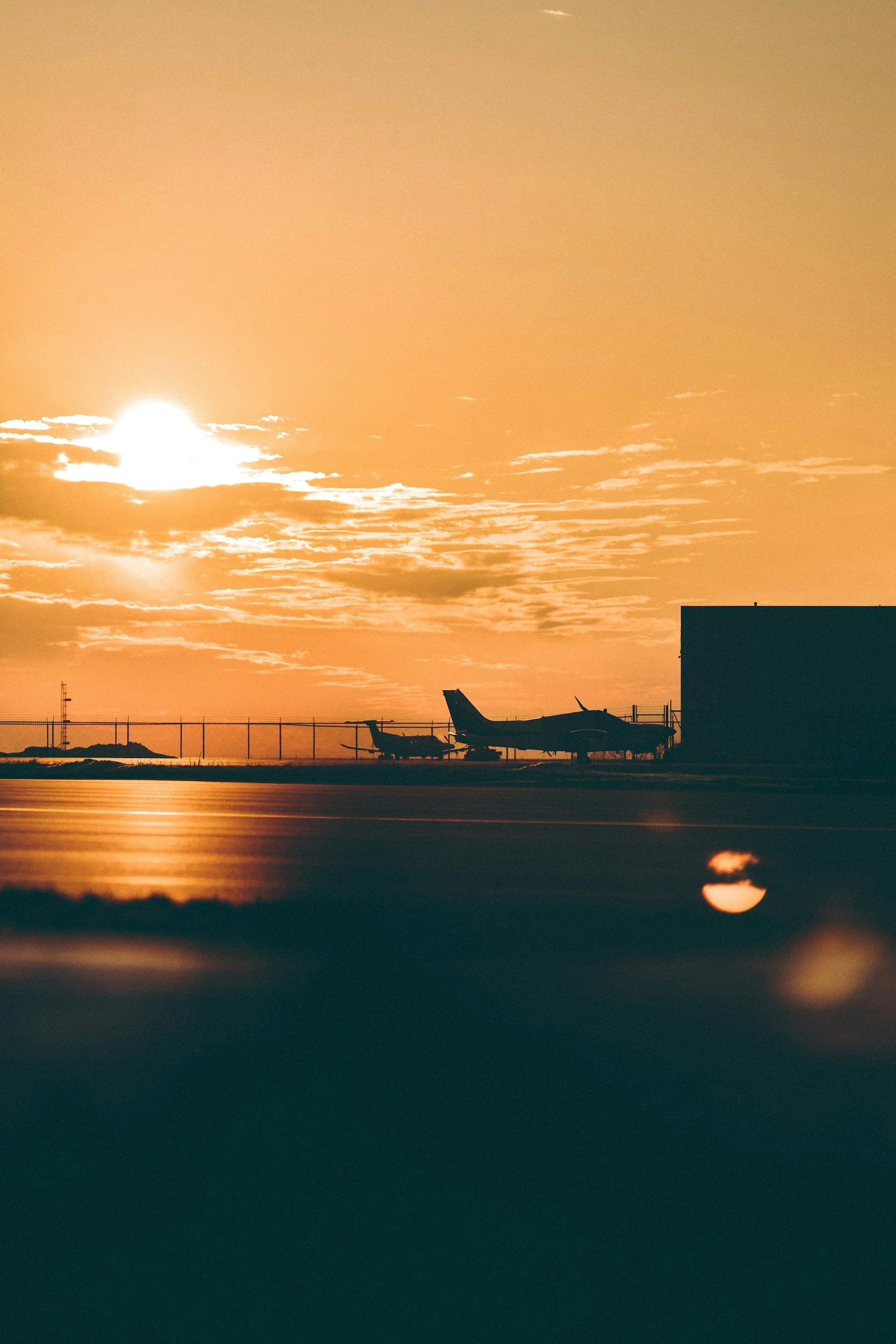 ⁠Corporate aircraft parked on a flight line apron during sunset, highlighting professional fleet care and asset protection.