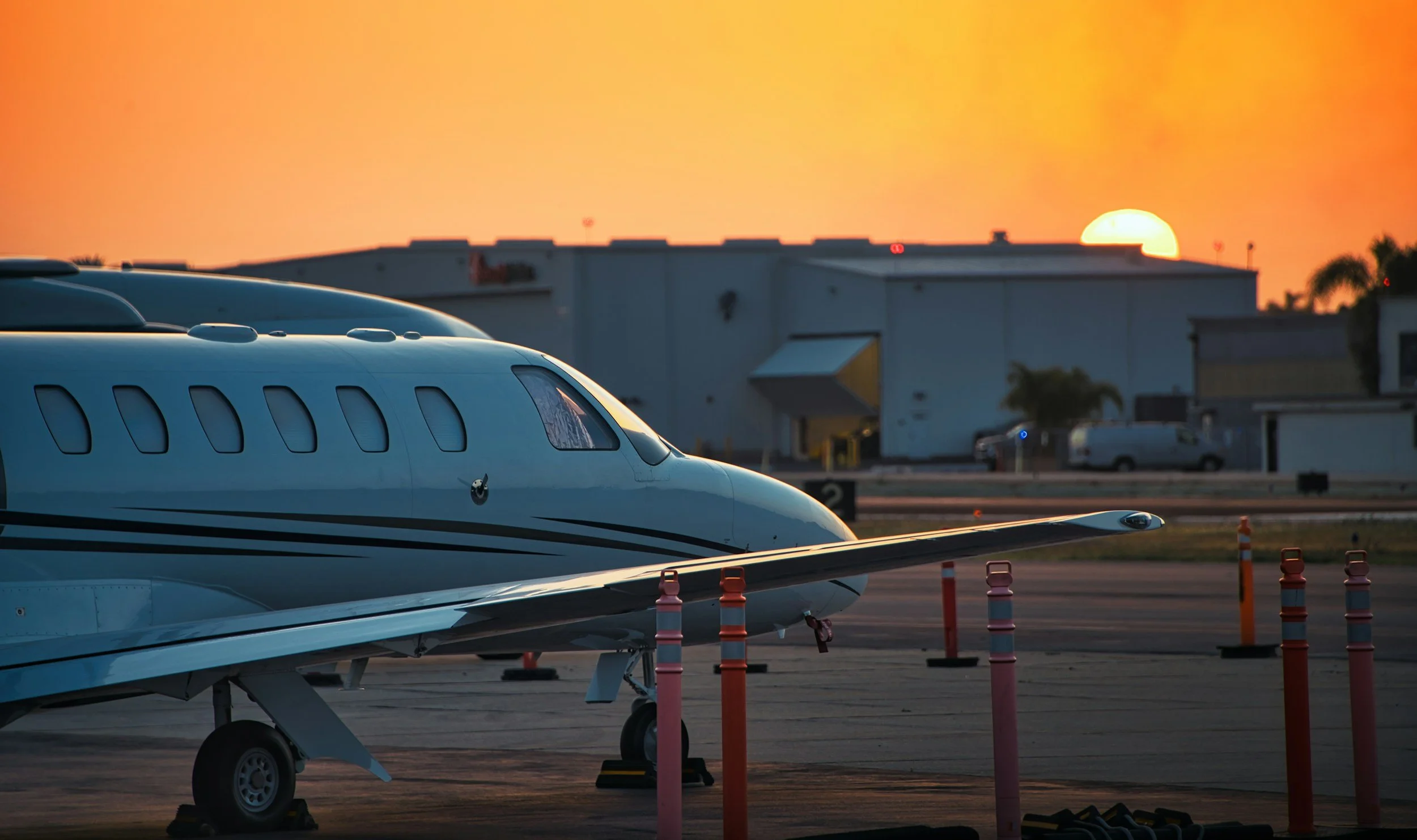 Private business jet on the flight line at sunset treated with premium aviation ceramic coating for maximum exterior protection.