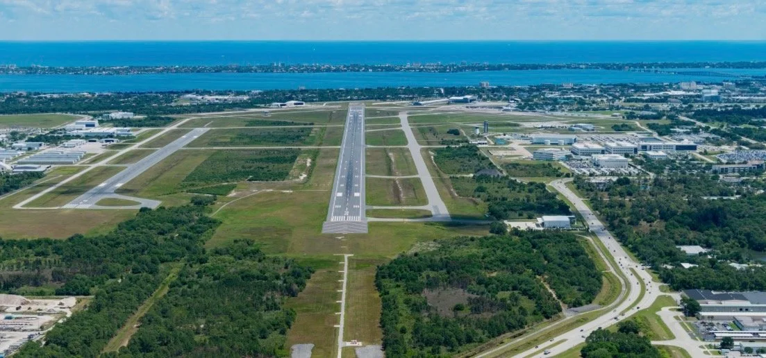⁠Aerial view of runways and hangars at Melbourne Orlando International Airport (MLB), a key hub for elite private jet detailing solutions.⁠