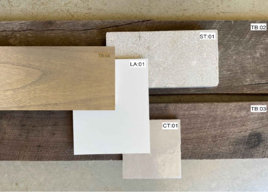 Samples of different types of wood and paint swatches labeled with codes, arranged on a wooden surface.