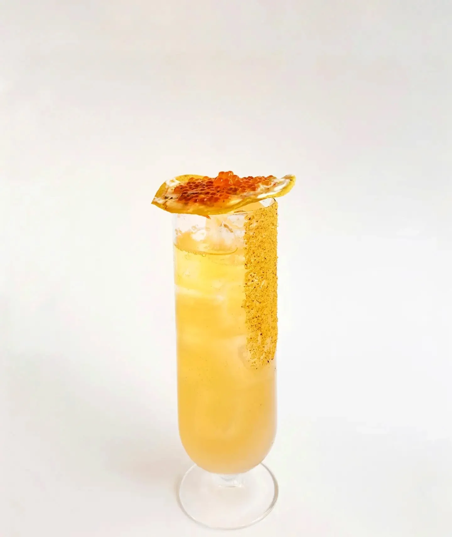 Our Tiger's milk michelada, is made with mezcal, lime, Mexican beer, and a tiger's milk shrub.
Nothing goes to waste on this drink as the ingredients used to make the shrub then get upcycled into a salsa for our trout roe tostada.

The trout roe tost
