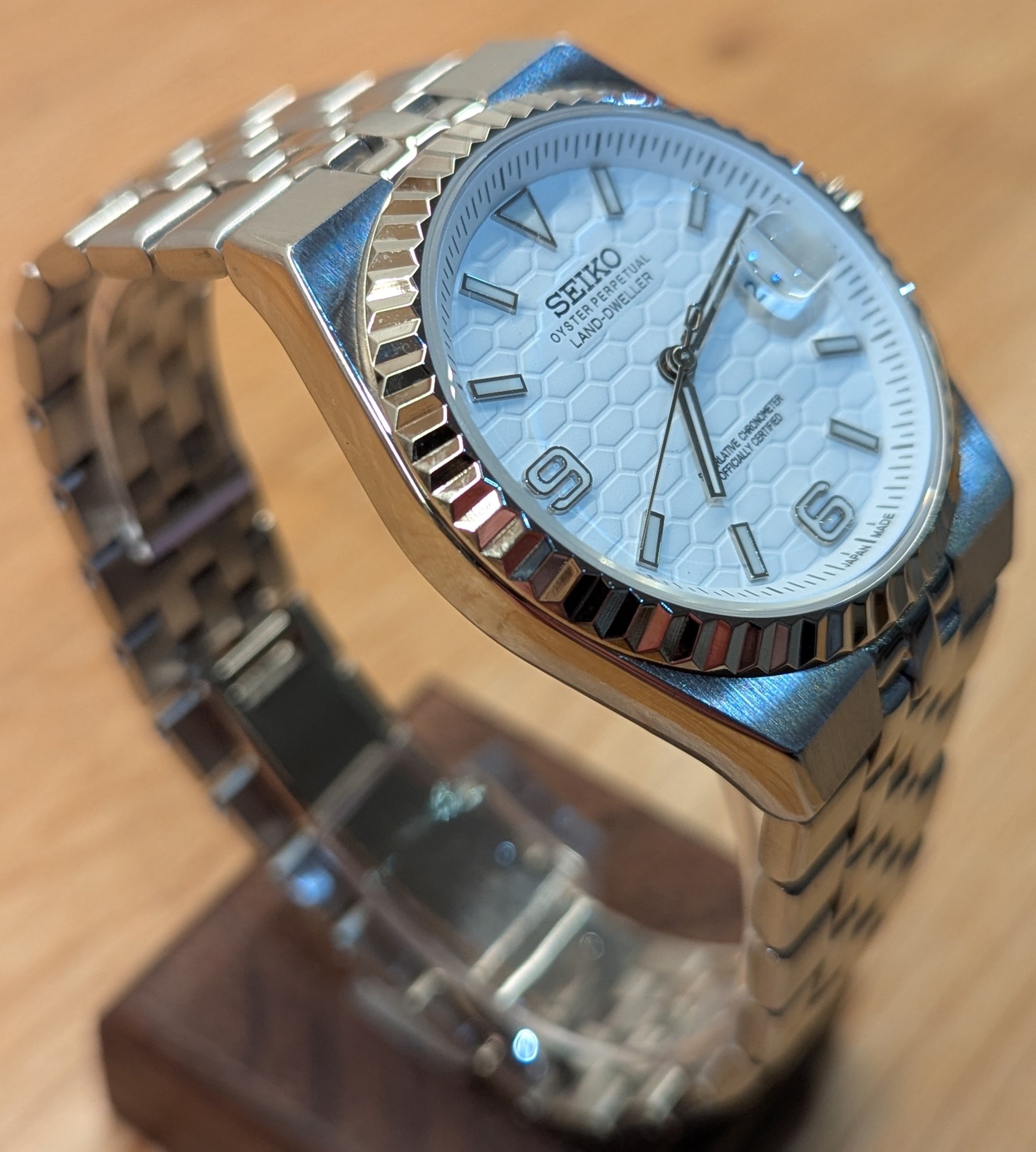 Land Dweller seiko mod honeycomb dial green blue white silver fluted bezel polished integrated bracelet