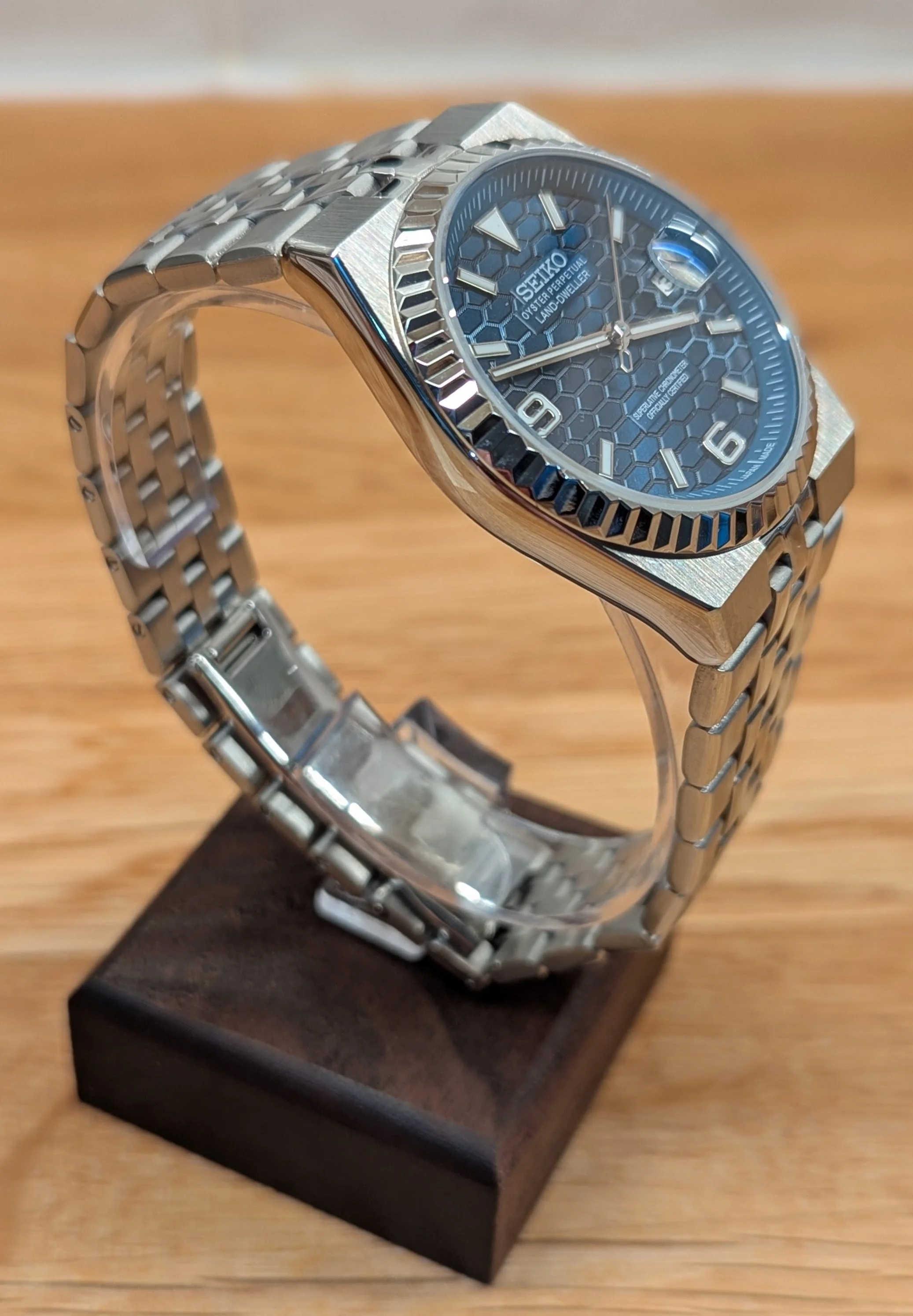 Land Dweller seiko mod honeycomb dial green blue white silver fluted bezel polished integrated bracelet