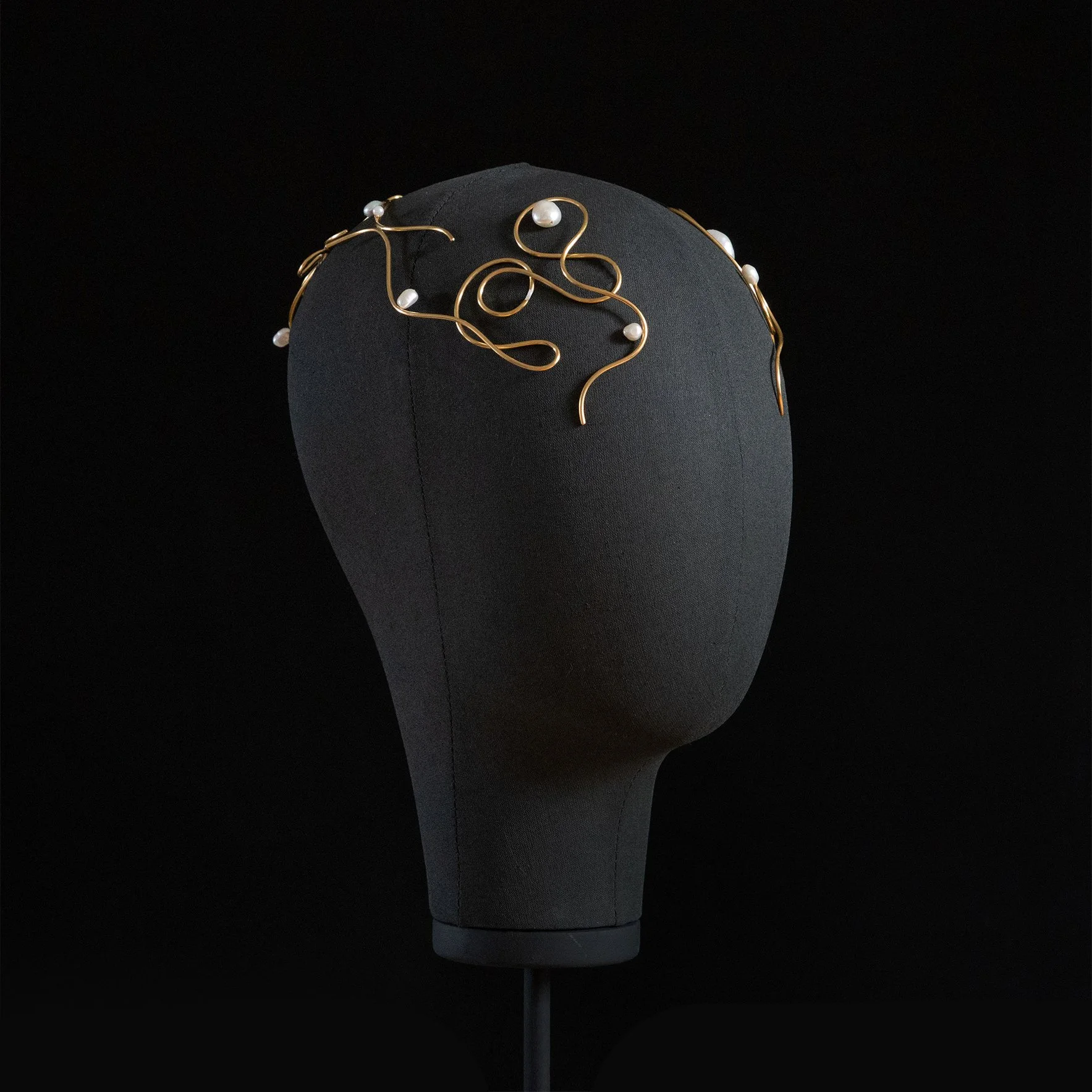 Baldpiece 005 by Laura Estrada, Scott Kelly and Ben Polkinghorne, 2021. Brass and mother of pearl