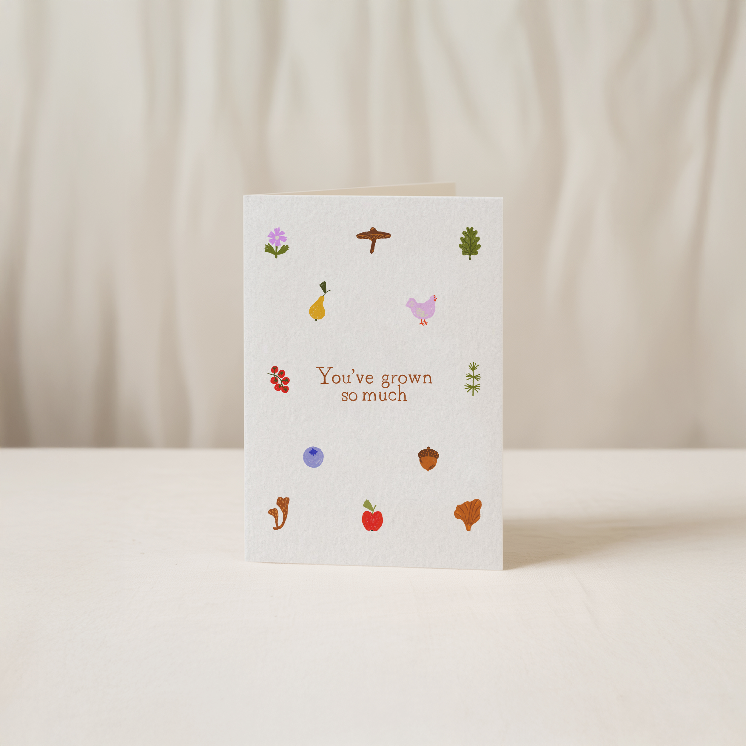 Whimsical greeting card featuring tiny woodland elements like a squirrel, acorn, and bird, with the text You've grown so much, original illustration by Kadna Anda
