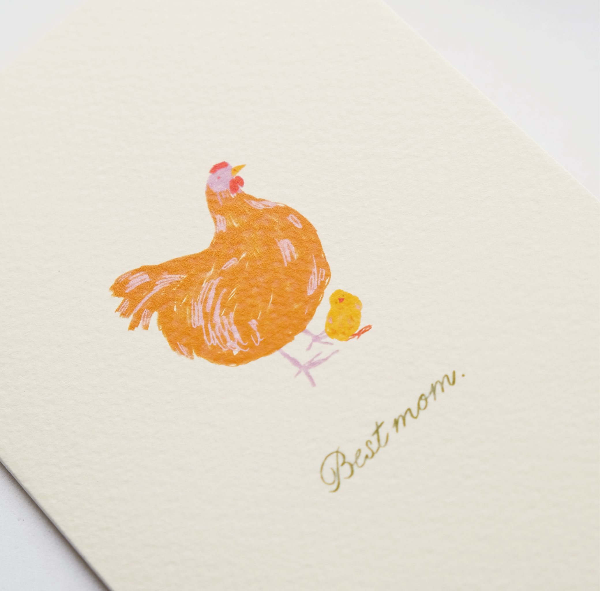 Heartwarming greeting card featuring an adorable illustration of a mother hen and chick with the text Best mom, original Mother's Day art by Kadna Anda