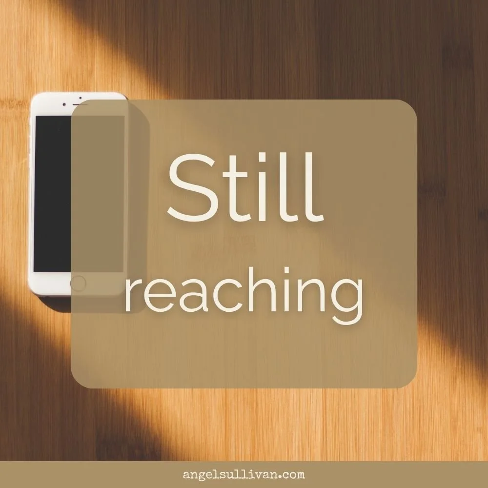 Still reaching (with a cell phone in the background)