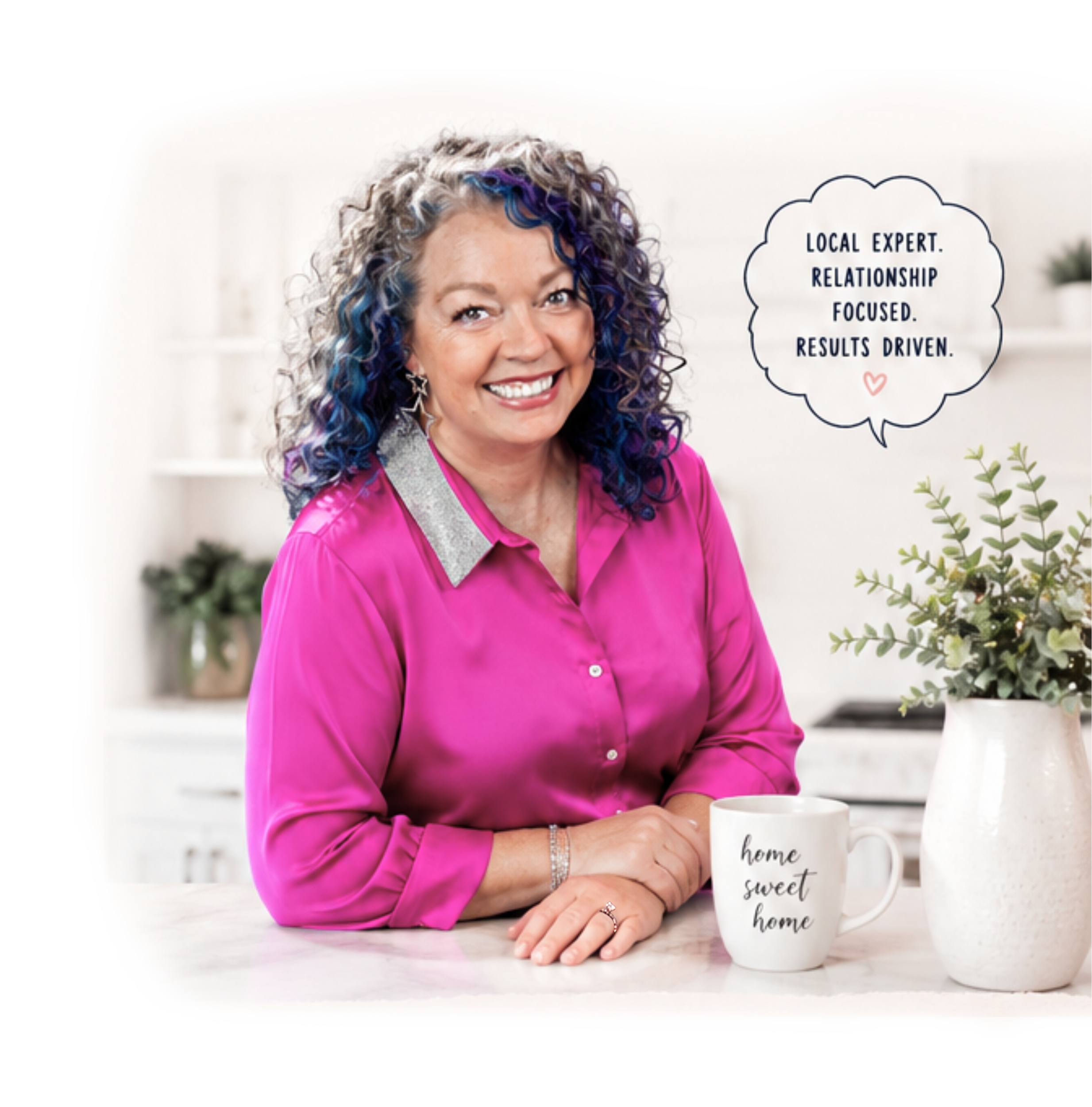 Lin Reynolds with The Unicorn Team in Tyler, Texas holding a white mug with the words 'home sweet home' written on it, sitting at a white table with green plants in the background.