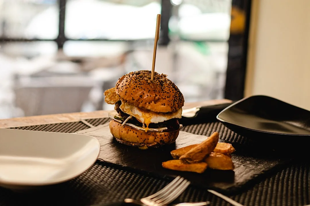 burger-with-egg-and-fries-served-on-restaurant-2026-03-24-07-07-18-utc.jpg