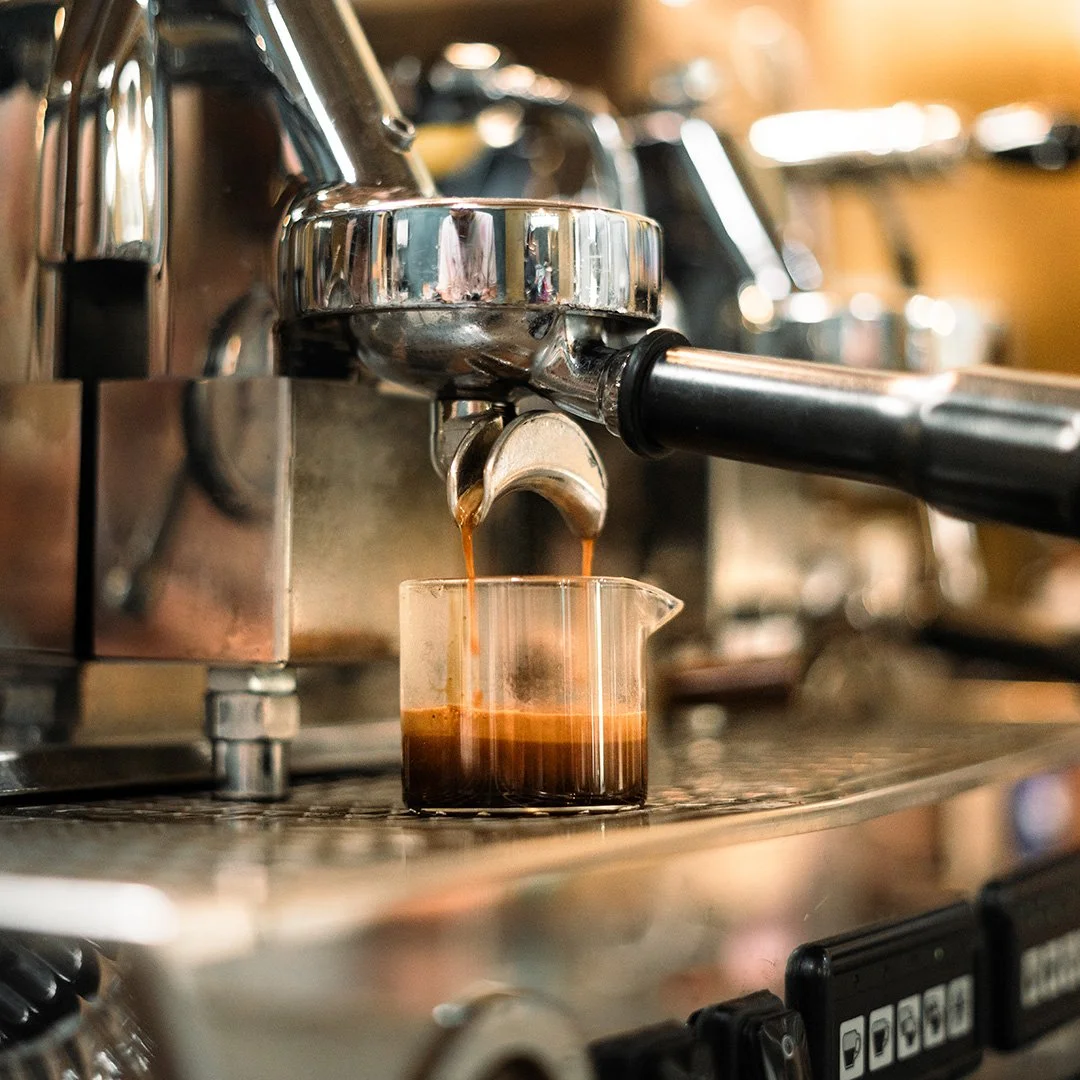 espresso-machine-pouring-hot-coffee-in-a-cafe-2026-01-09-06-26-25-utc.jpg