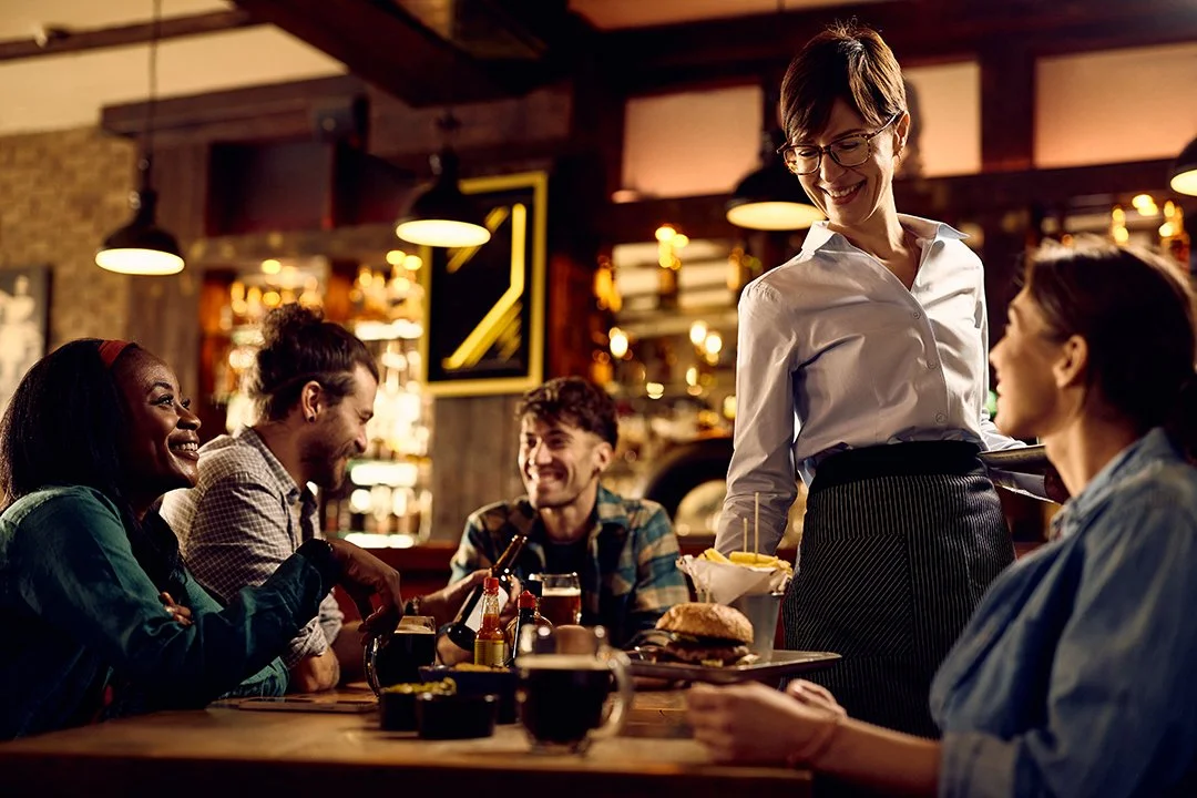 happy-waitress-serving-burgers-and-french-fries-to-2026-03-16-03-29-48-utc.jpg