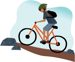 Person riding a bicycle down a rocky trail with mountains in the background.