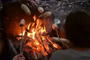 Cooking+bannock+on+the+fire.webp