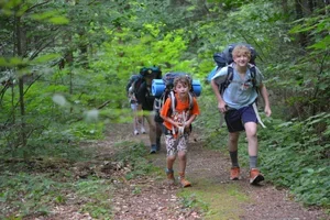 Sebastian+Goffin+(Warren)+and+Asher+Adams+(Waitsfield)+are+leading+the+group+on+a+hike+to+camp+in+the+Green+Mountain+National+Forest.webp