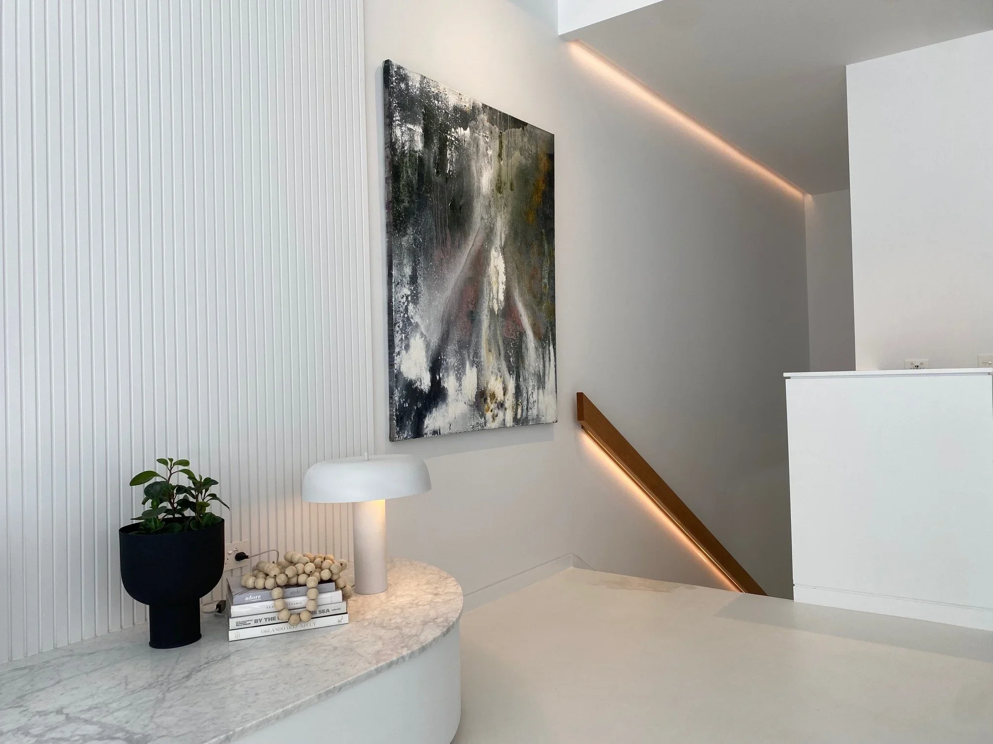 white concrete house interior staircase custom handrail