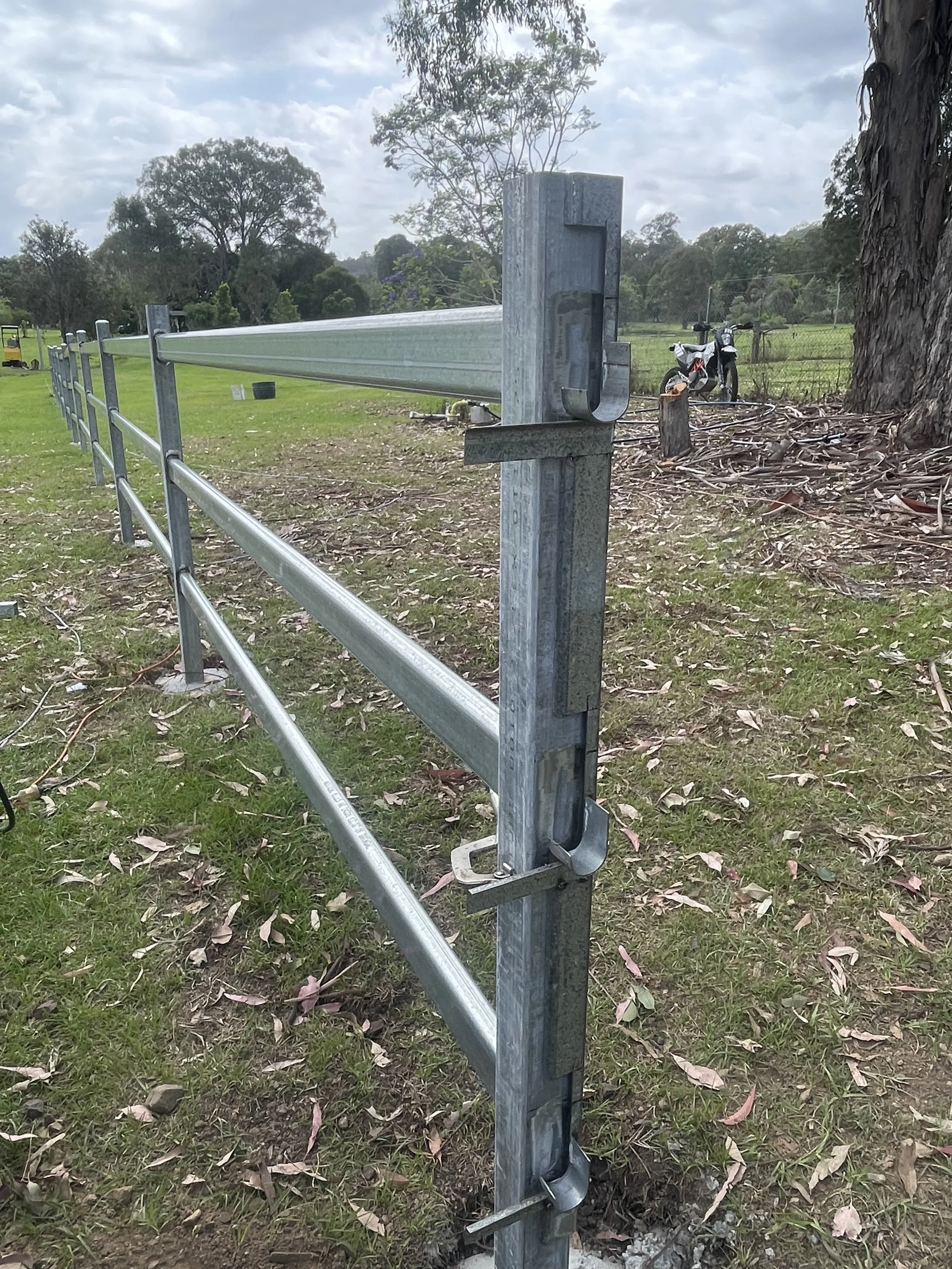 galvanised steel cattle rail fencing on a rural property