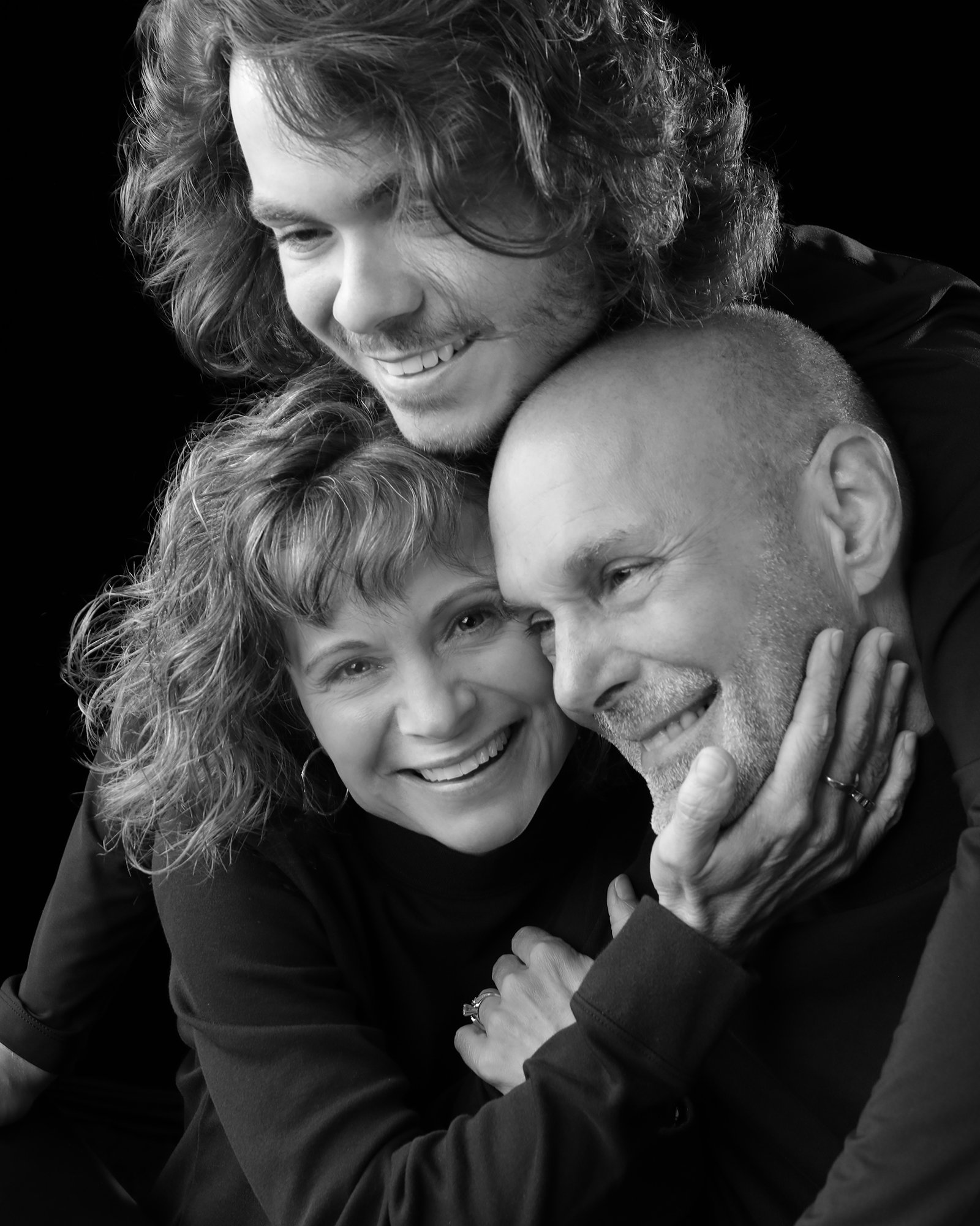 Three family members embracing, black and white BOND family portrait by Joe Craig at Soulmarks in Dexter, Missouri