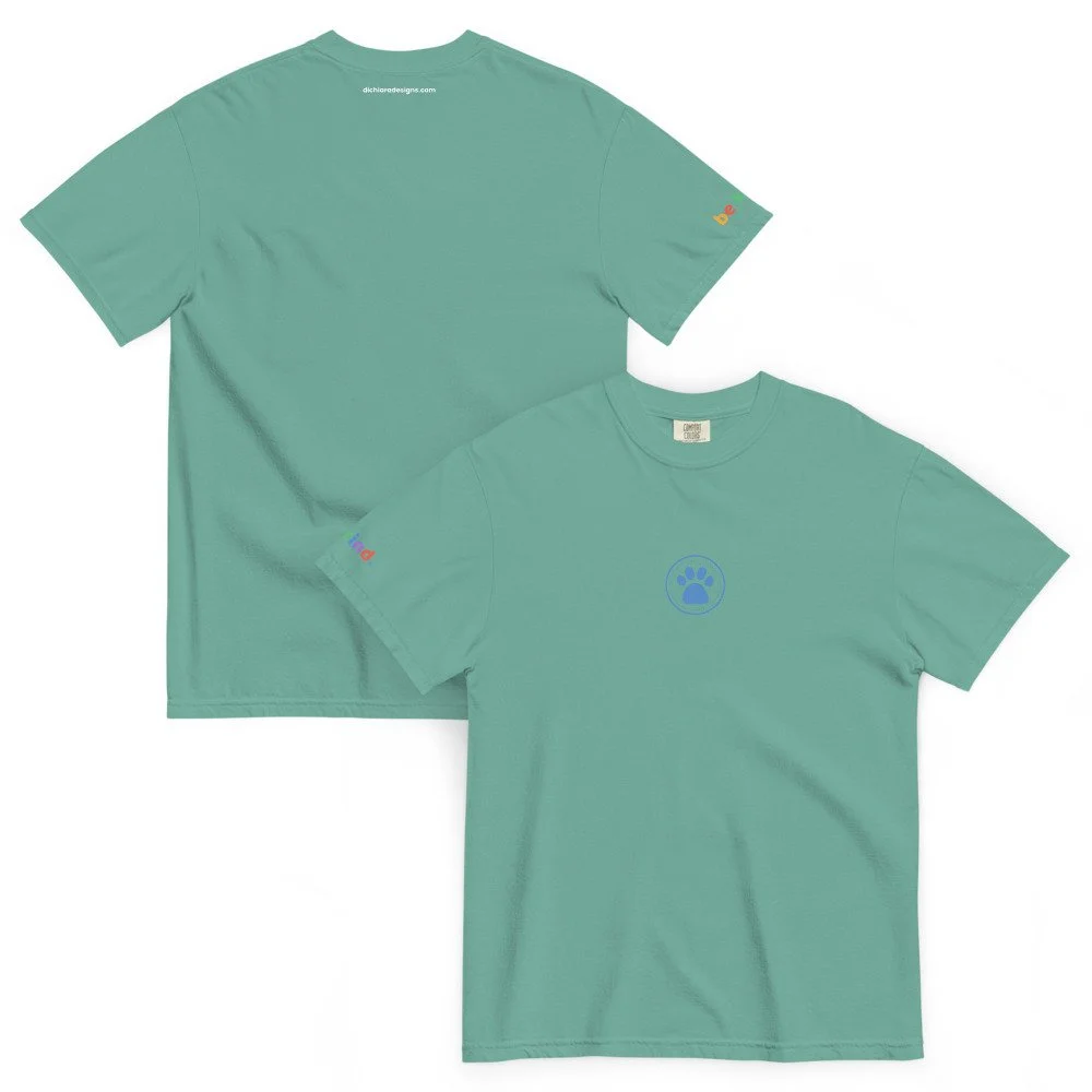 Seafoam heavyweight t-shirt with blue paw print on the front, rainbow be kind logo on right sleeve and dichiaradesigns.com on the back