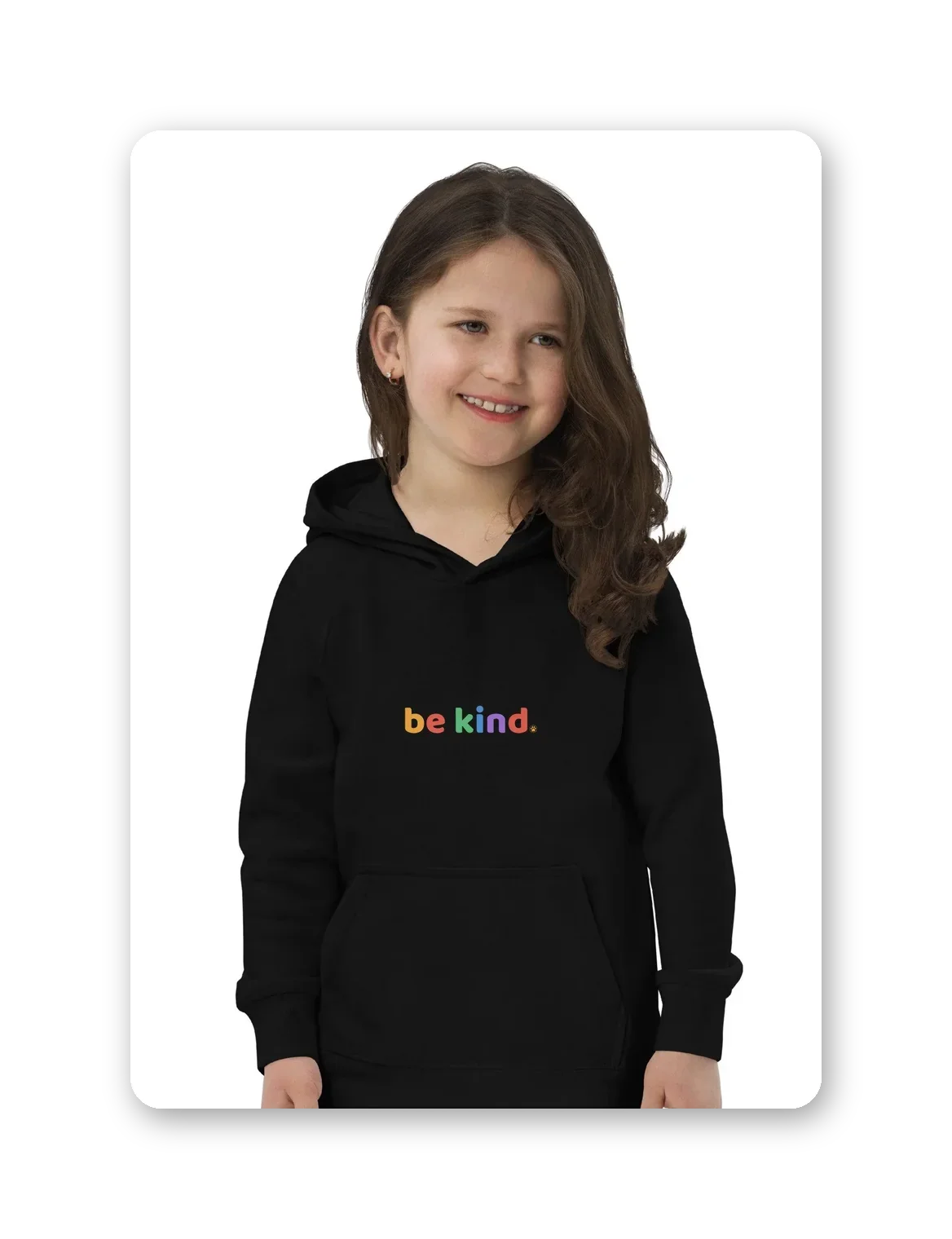 Child wearing a black kids hoodie with the rainbow be kind wordmark across the chest