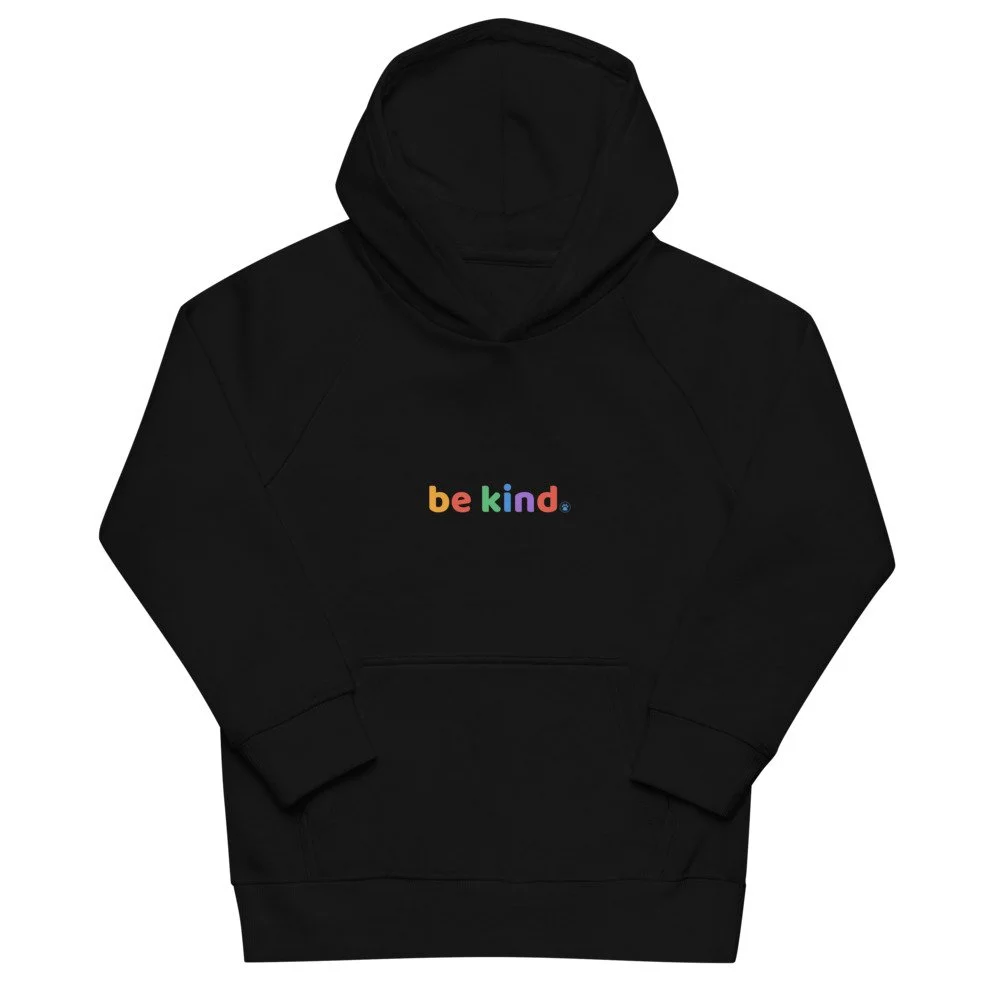 Black kids' hoodie shown flat with the rainbow be kind print across the chest
