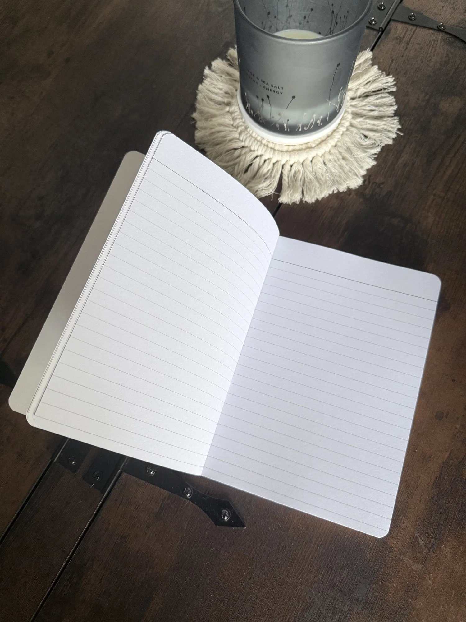 Be Kind journal open flat showing two blank lined pages, perforated and ready to write on