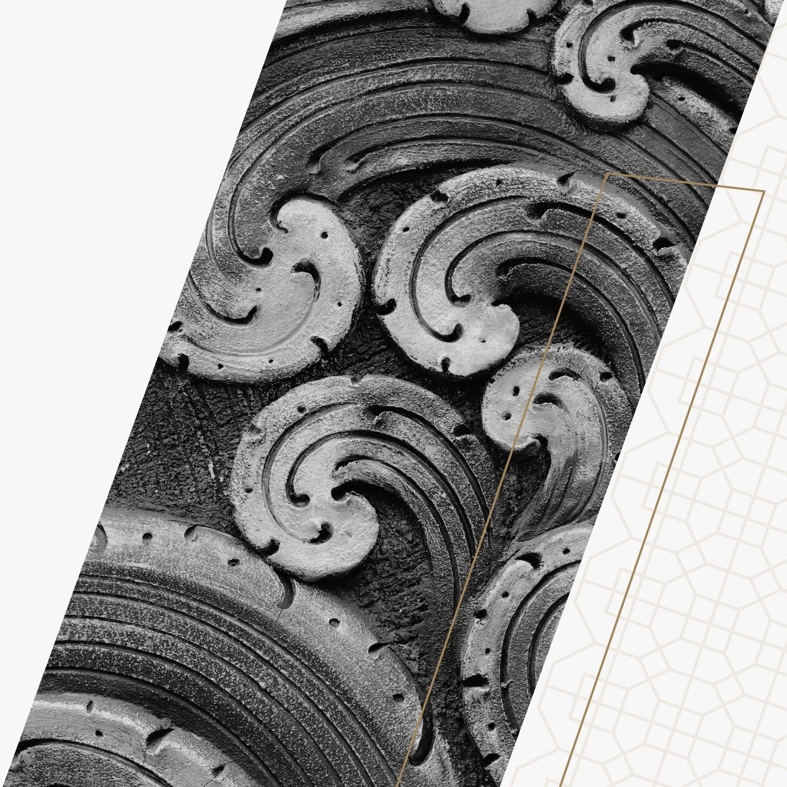 Decorative metalwork with swirling patterns, featuring a textured, aged surface in black and white.