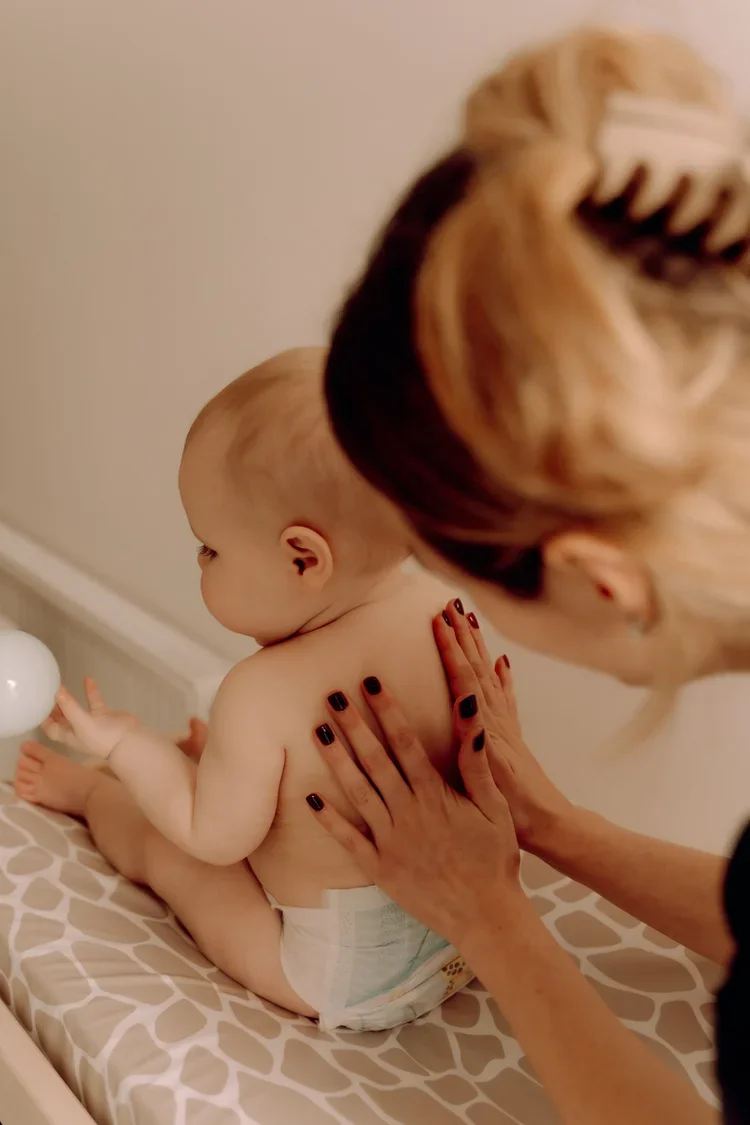 Massaging baby on their back