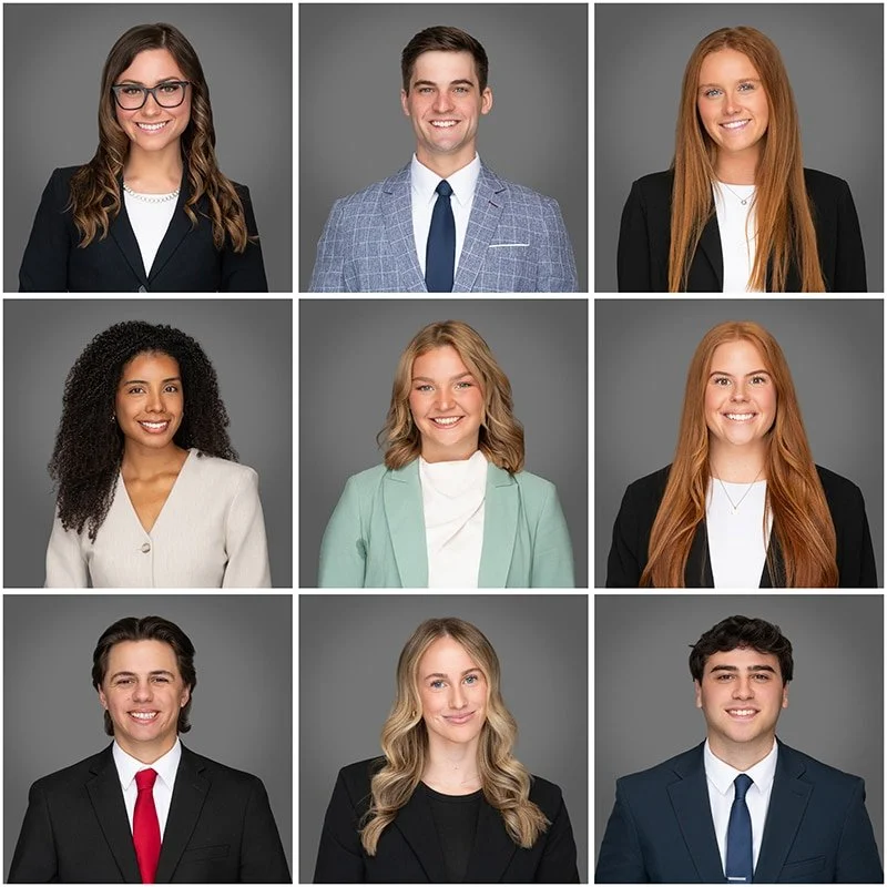 A grid of professional corporate headshots featuring diverse team members, presented against a neutral gray studio background.