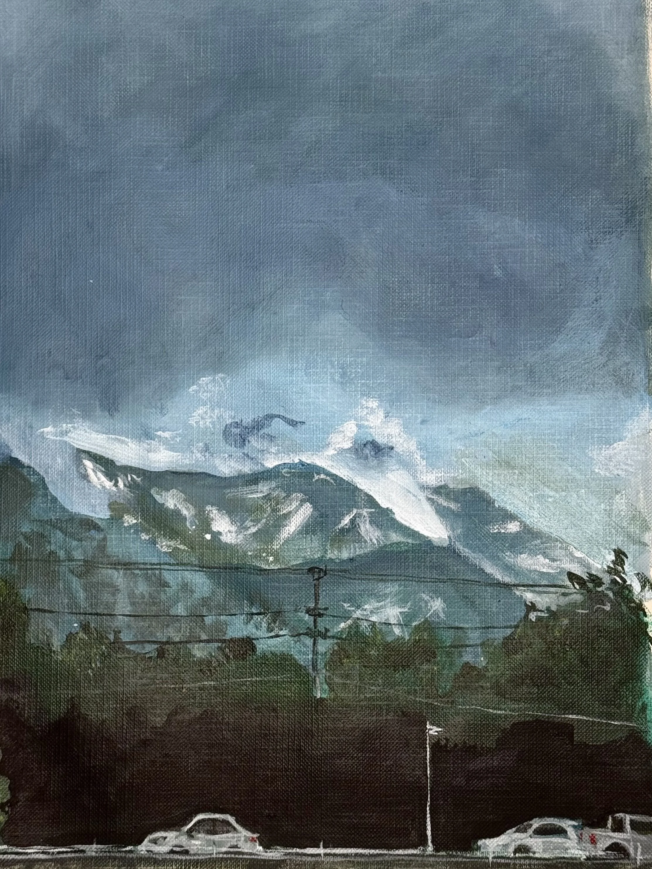 Painting of a mountainous landscape with snow-capped peaks, clouds, and a blue sky, with cars and streetlights in the foreground.