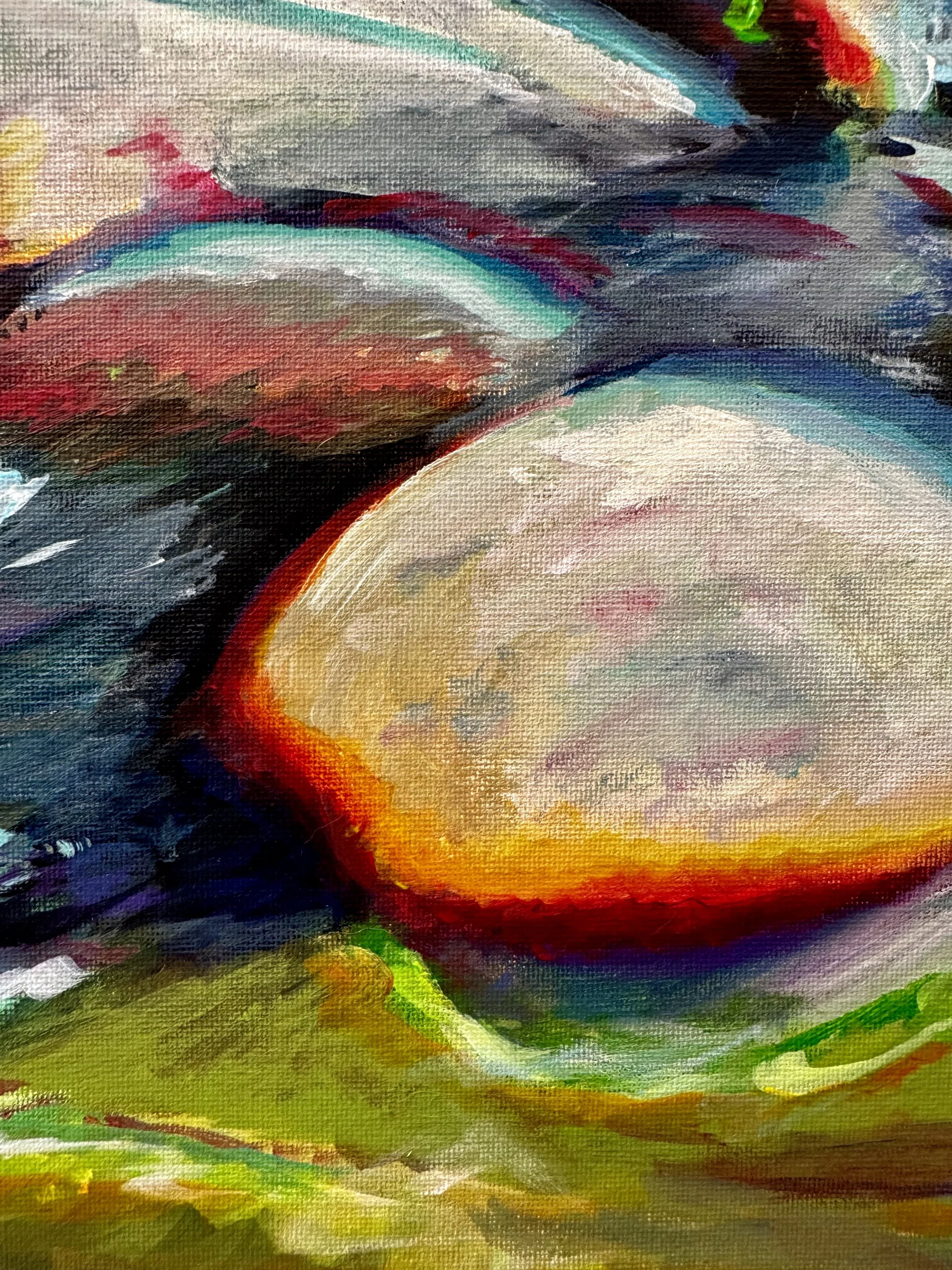 Close-up of an abstract painting with vibrant colors including reds, blues, greens, and yellows, with textured brushstrokes.