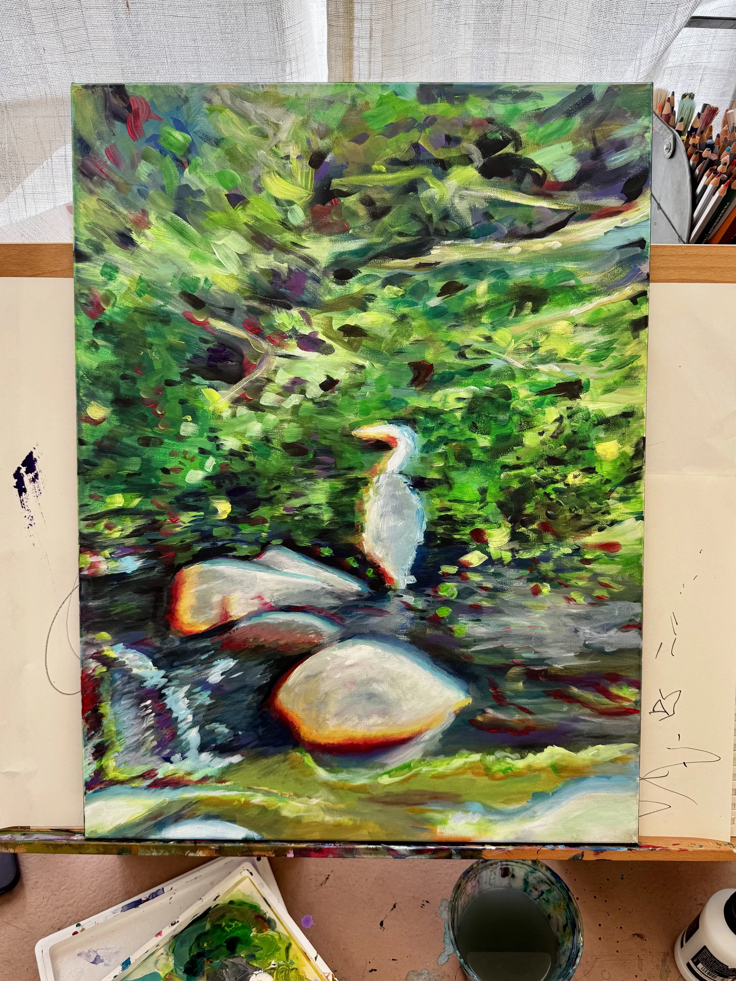 A colorful abstract painting of a scene with green foliage, dark shadows, and a white bird, possibly a heron, standing near water.