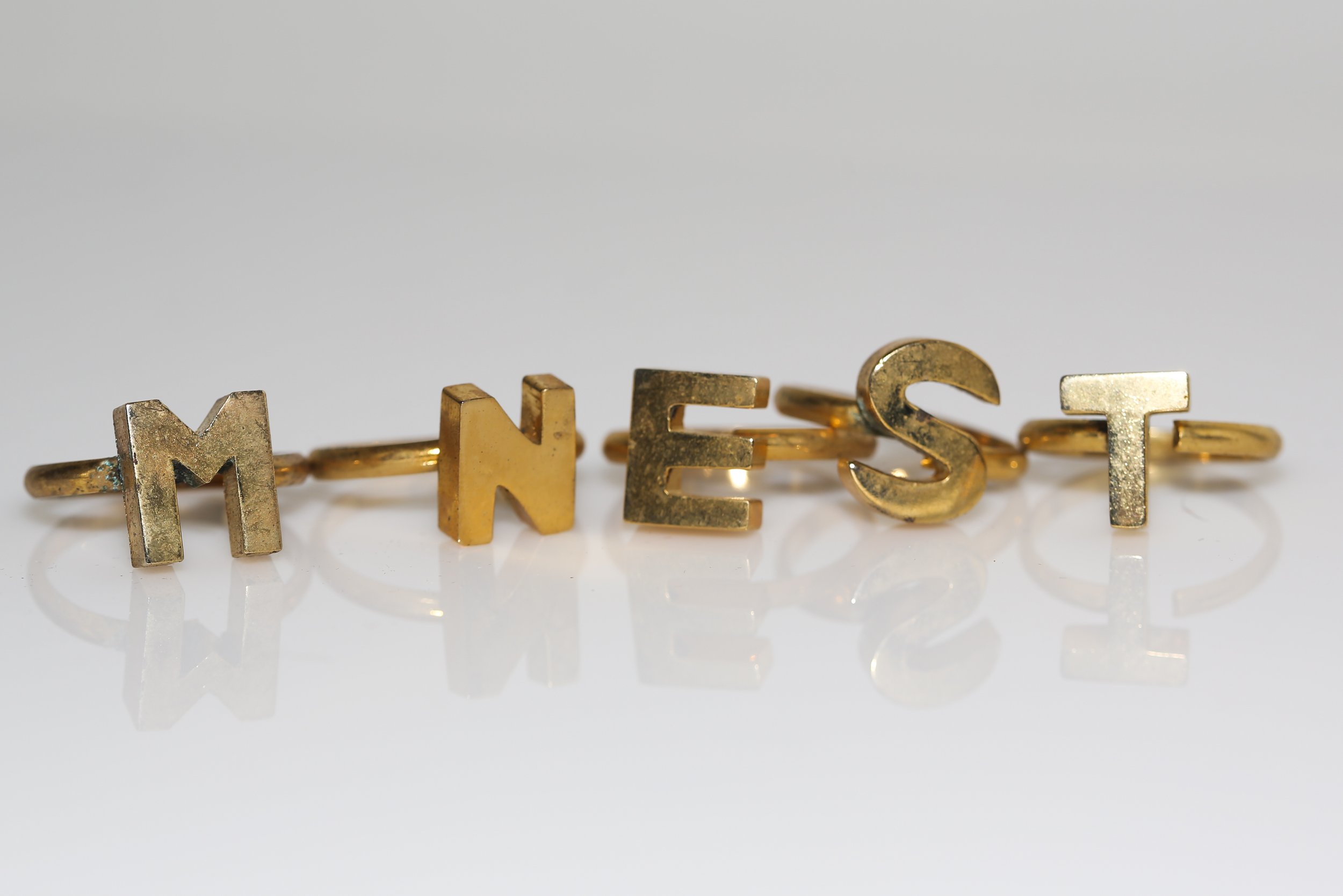 MID-CENTURY INITIAL RINGS
