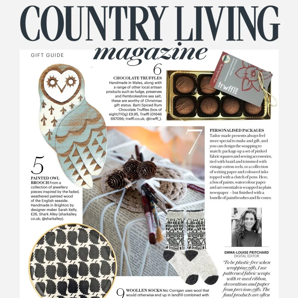 Cover of Country Living magazine featuring Christmas gift ideas, including chocolate truffles, painted owl brooch, personalized packages, and woolen socks.