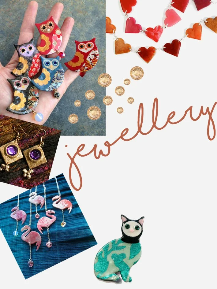 Collection of jewelry, accessories, and decorations with an owl, heart-shaped garland, earrings, flamingo necklaces, and a cat figurine, labeled 'jewelry'.