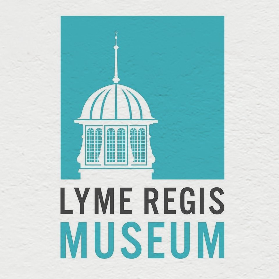 Logo of Lyme Regis Museum featuring a white outline of a domed building with a spire on a teal background, with the words 'Lyme Regis Museum' underneath in black and teal text.
