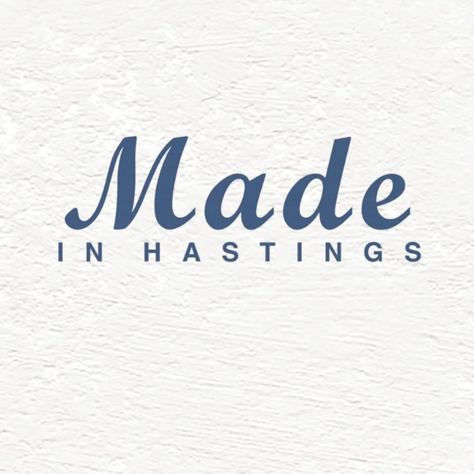 Text reading 'Made in Hastings' on a textured white background.