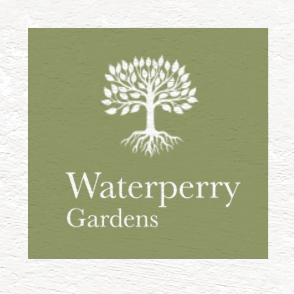 Logo for Waterperry Gardens with a white tree illustration on a green background.