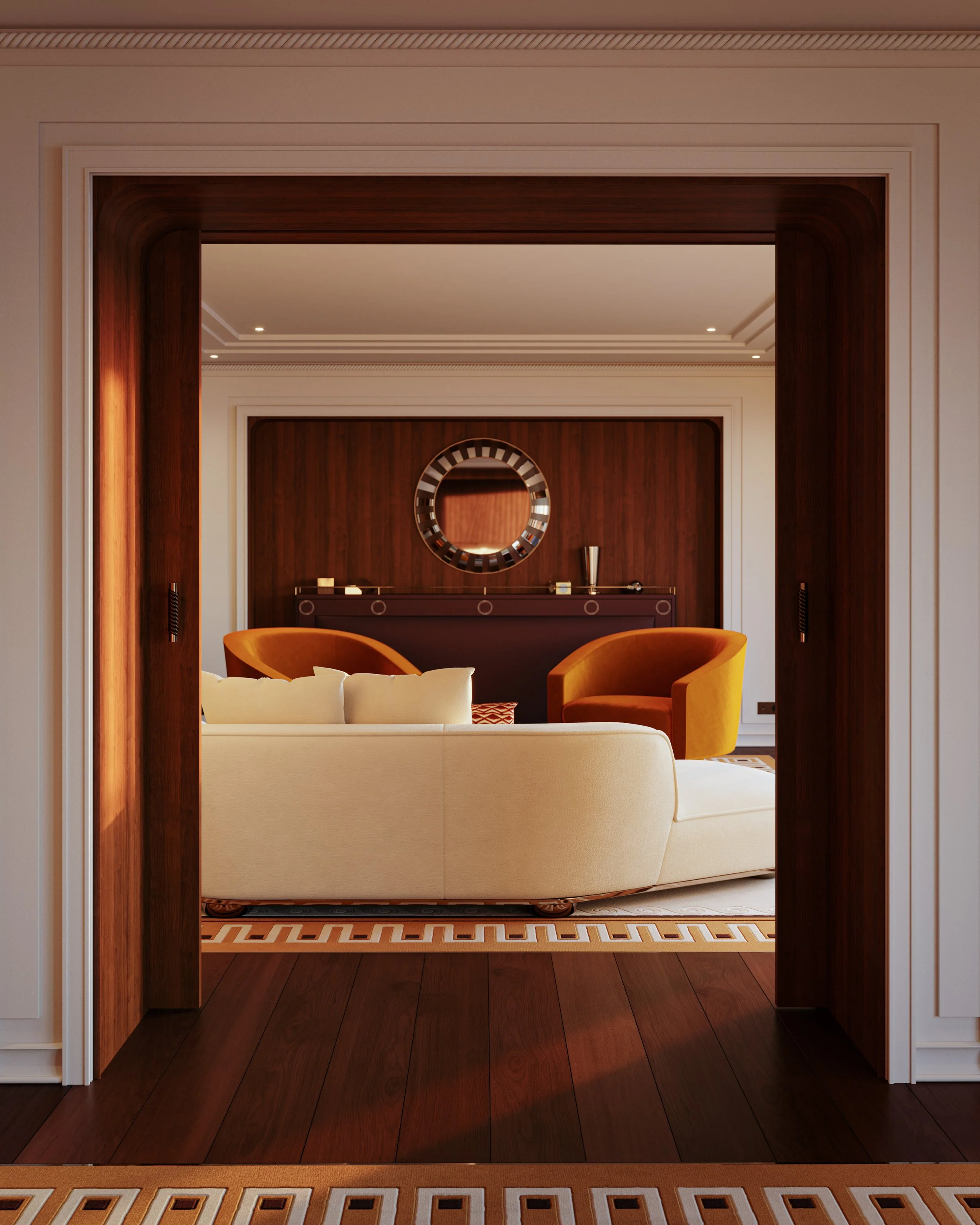 Elegant living room with beige and dark wood accents, featuring a circular wall mirror and modern decor, viewed through an arched doorway.