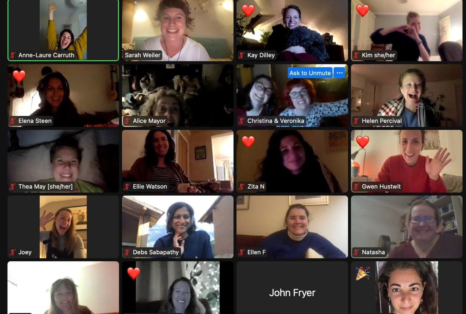 A virtual group video call featuring 20 women and a dog, with some participants smiling, laughing, and waving. Several participants have heart icons next to their names, indicating affection or favorites.